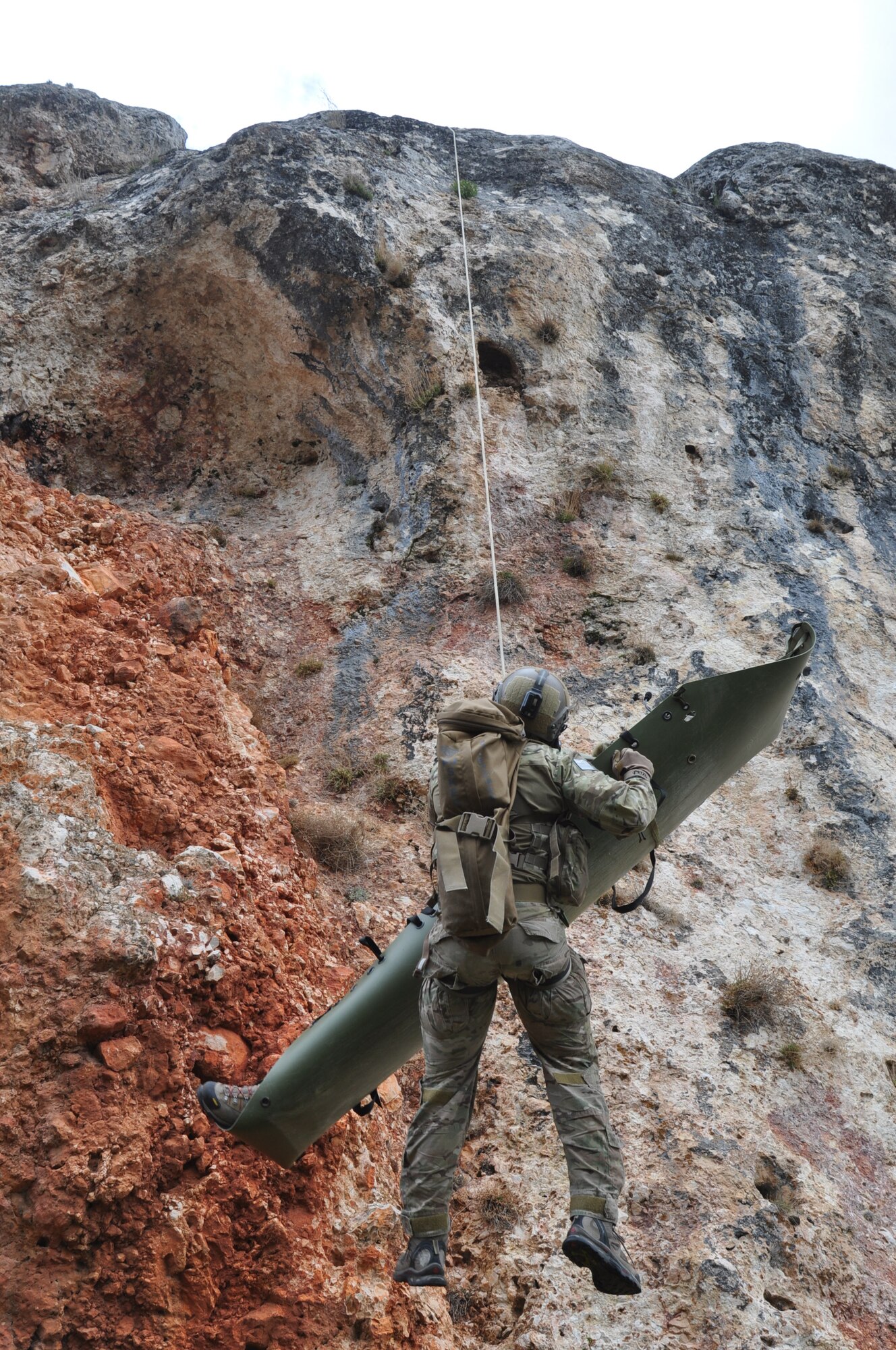 A U.S. Air Force combat search and rescue team hoists a pararescueman and his patient up a cliff face April 7, 2015, during ISIK, an international CSAR event, in Konya, Turkey. Personnel recovery was one of the primary skillets the ISIK training scenarios covered. (U.S. Air Force photo by Capt. Laura Balch)
