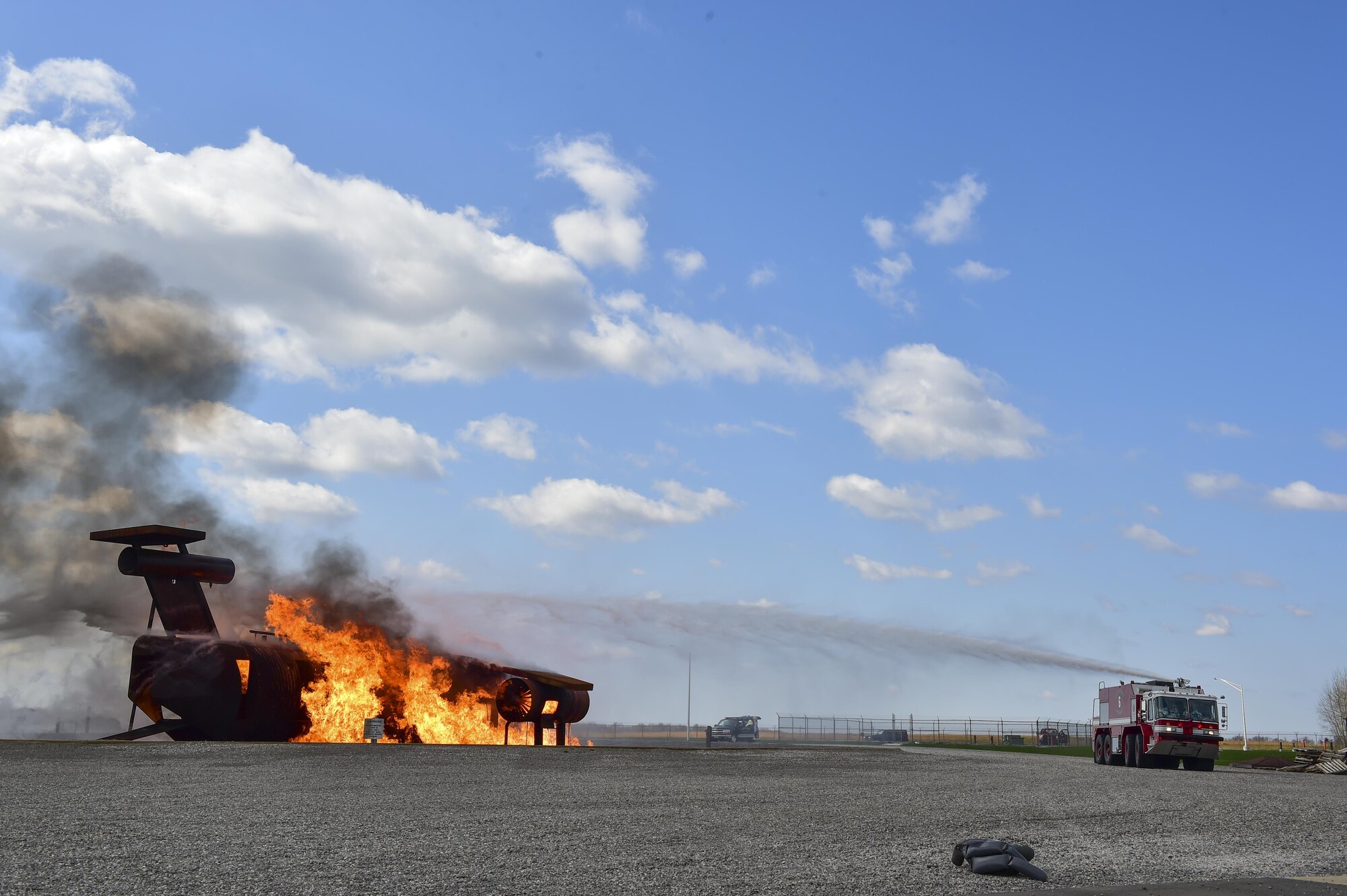 Firefighters from the 910th Civil Engineers Squadron Fire Department battle a blaze on a training aircraft, simulating a commercial aircraft after terrorists detonate and explosive device during and exercise here, April 24, 2015. Participating agencies included the Western Reserve Port Authority, Youngstown-Warren Regional Airport, local law enforcement and fire departments, the Federal Bureau of Investigation, the Federal Aviation Administration and Air Force Reserve. (U.S. Air Force photo/Eric M. White)