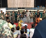 PUERTO PRINCESA CITY, PALAWAN, Philippines (Apr. 22, 2015) - U.S. Air Force Staff Sgt. Gary Held, 374th Medical Operations Squadron medical technician and Cooperative Health Engagement instructor, provides feedback to local health workers on their response to a mass casualty training scenario as part of exercise Balikatan's first responder training. U.S. military and Armed Forces of the Philippines training instructors worked shoulder-to-shoulder to train 179 health workers and members of other local agencies to learn skills and techniques to better respond to a mass casualty. This year marks the 31st iteration of the exercise, which is an annual Philippine-U.S. bilateral military training exercise and humanitarian civic assistance engagement. 