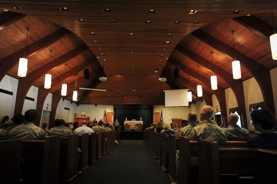 Maureen Deihl reads a poem during the Holocaust memorial service at the base chapel on Hurlburt Field Fla., April 22, 2015. The memorial was held as a remembrance to honor those who lost their lives during the Holocaust. (U.S. Air Force photo by Senior Airman Meagan Schutter)
