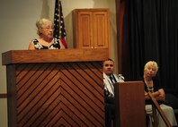 Brigitte Monturo speaks of her friend, an Auschwitz survivor, during the Holocaust memorial service held at the base chapel on Hurlburt Field Fla., April 22, 2015. The memorial was held as a remembrance to honor those who lost their lives during the Holocaust. (U.S. Air Force photo by Senior Airman Meagan Schutter)