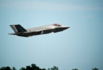 Col. Christopher Niemi, 33rd Operations Group commander and F-35A Lightning II instructor pilot, performs a touch-and-go before landing on Eglin Air Force Base, Florida, April 23, 2015. Niemi served as an instructor pilot and wingman during Royal Australian Air Force Squadron Leader Andrew Jackson's final training flight. Jackson made history as the first Australian pilot to fly in the F-35A. The fifth-generation aircraft will meet Australia’s future air combat and strike needs, providing a networked force-multiplier effect in terms of situational awareness and combat effectiveness. (U.S. Air Force photo by Staff Sgt. Marleah Robertson)