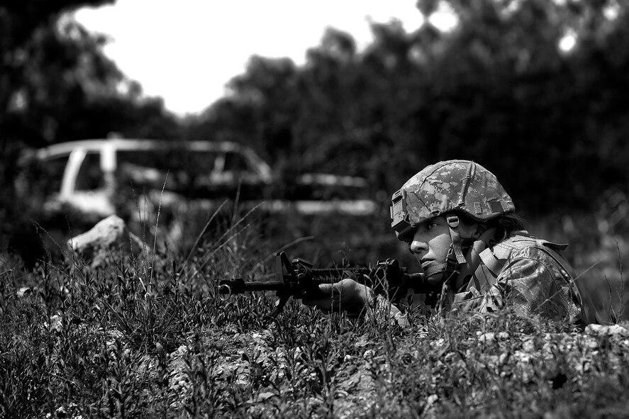 Corrie J. Shafer, Angelo State University Air Force ROTC Detachment 847 cadet, aims down her sights during a field training exercise at a deployed simulation village near Camp Sentinel, April 18, 2015. The FTX is designed to give cadets a broader understanding of what the Air Force is truly like before committing to serve. (U.S. Air Force photo by Airman 1st Class Devin Boyer)
