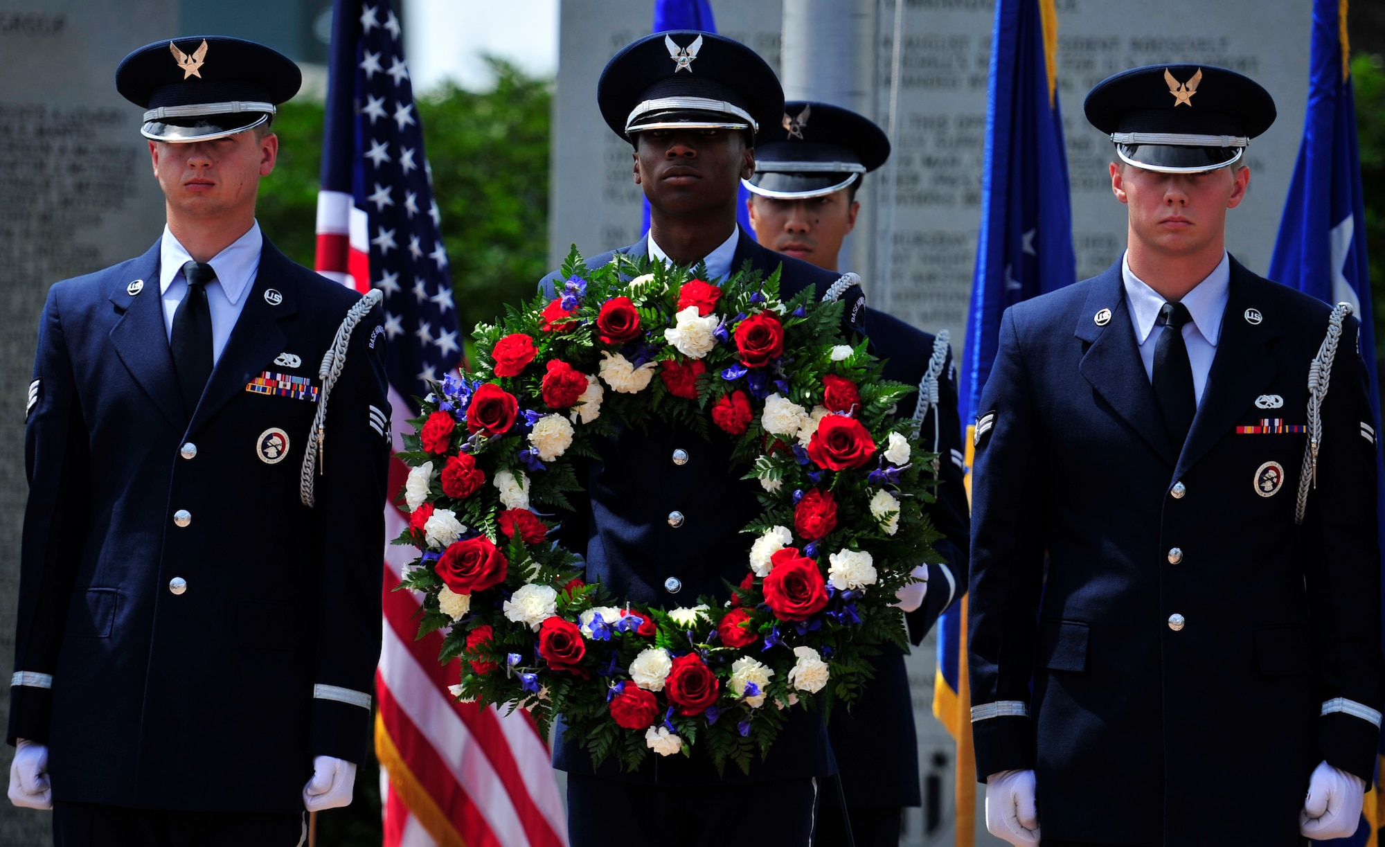 The honor guard presents a wreath during the Operation Eagle Claw memorial ceremony at the air park on Hurlburt Field, Fla., April 24, 2015.  The rose wreath was placed in honor of the eight service members who lost their lives during the operation. (U.S. Air Force photo/Staff Sgt. Melanie Holochwost)