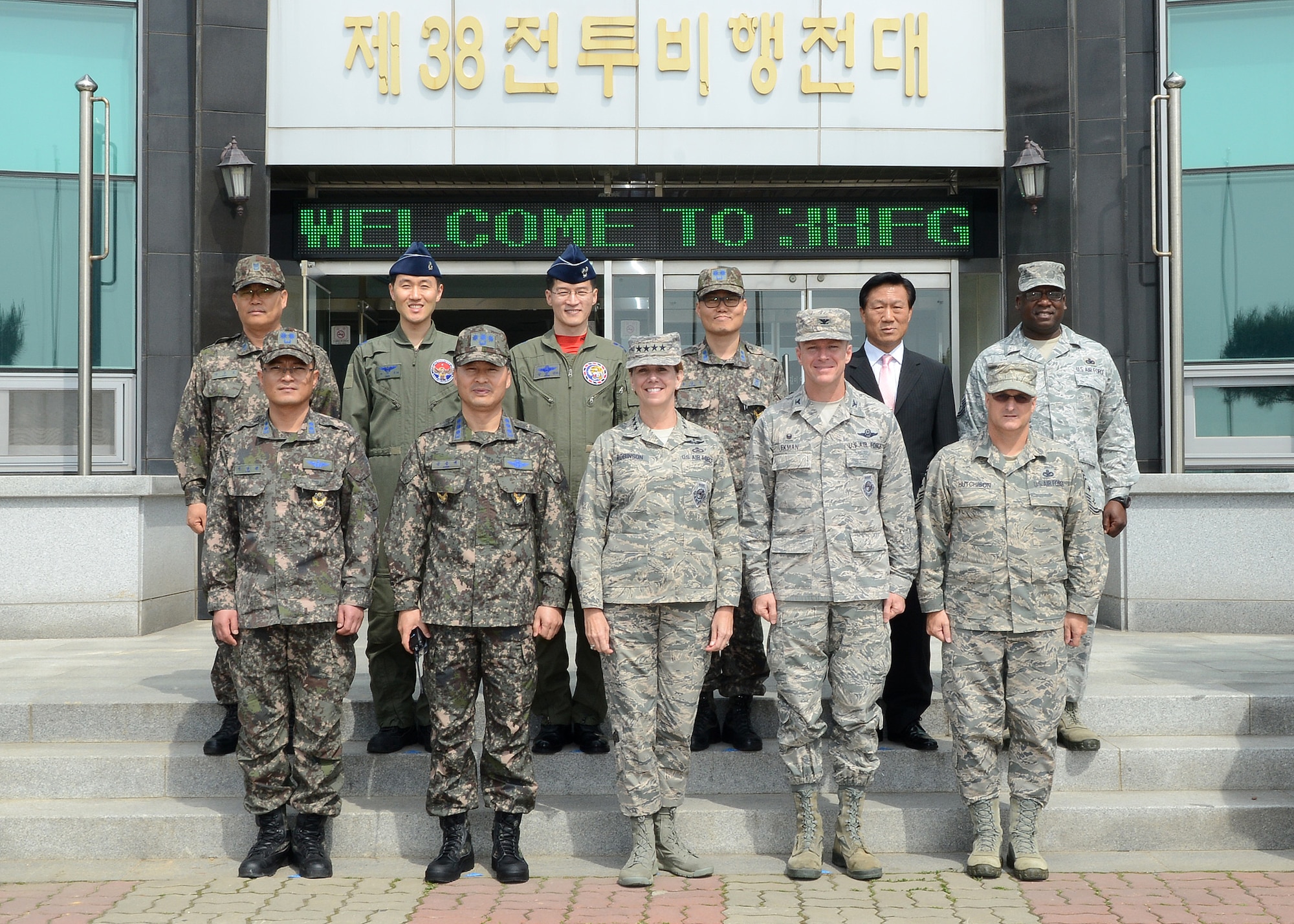 Gen. Lori J. Robinson, Pacific Air Forces commander (center), poses with 8th Fighter Wing and Republic of Korea Air Force 38th Fighter Group leadership during her visit to Kunsan Air Base, ROK, April 23, 2015. Robinson met with ROKAF 38th FG leadership to learn about the ROKAF flying mission at Kunsan, which is the only base on the Korean peninsula where U.S. Air Force and ROKAF flying units are stationed and train together. (Photo courtesy of ROKAF 38th FG Public Affairs) 