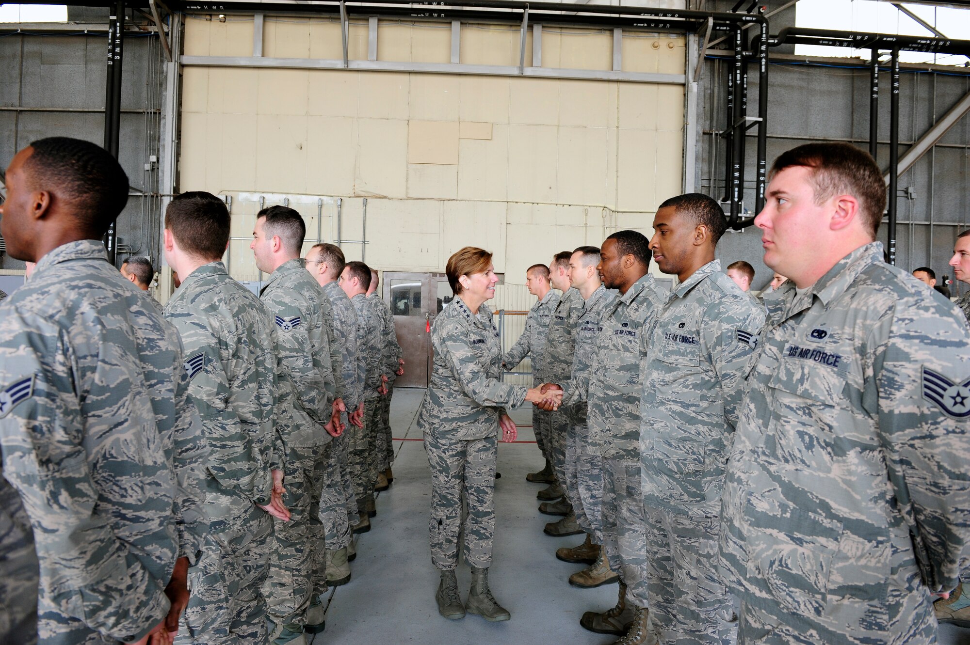 Gen. Lori J. Robinson, Pacific Air Forces commander, shakes hands with 8th Aircraft Maintenance Squadron Airmen during her visit to Kunsan Air Base, Republic of Korea, April 23, 2015. Robinson had the opportunity to see firsthand how Kunsan Airmen contribute to deterring aggression on the Korean Peninsula during her first visit to Kunsan. (U.S. Air Force photo by Senior Airman Taylor Curry/Released) 