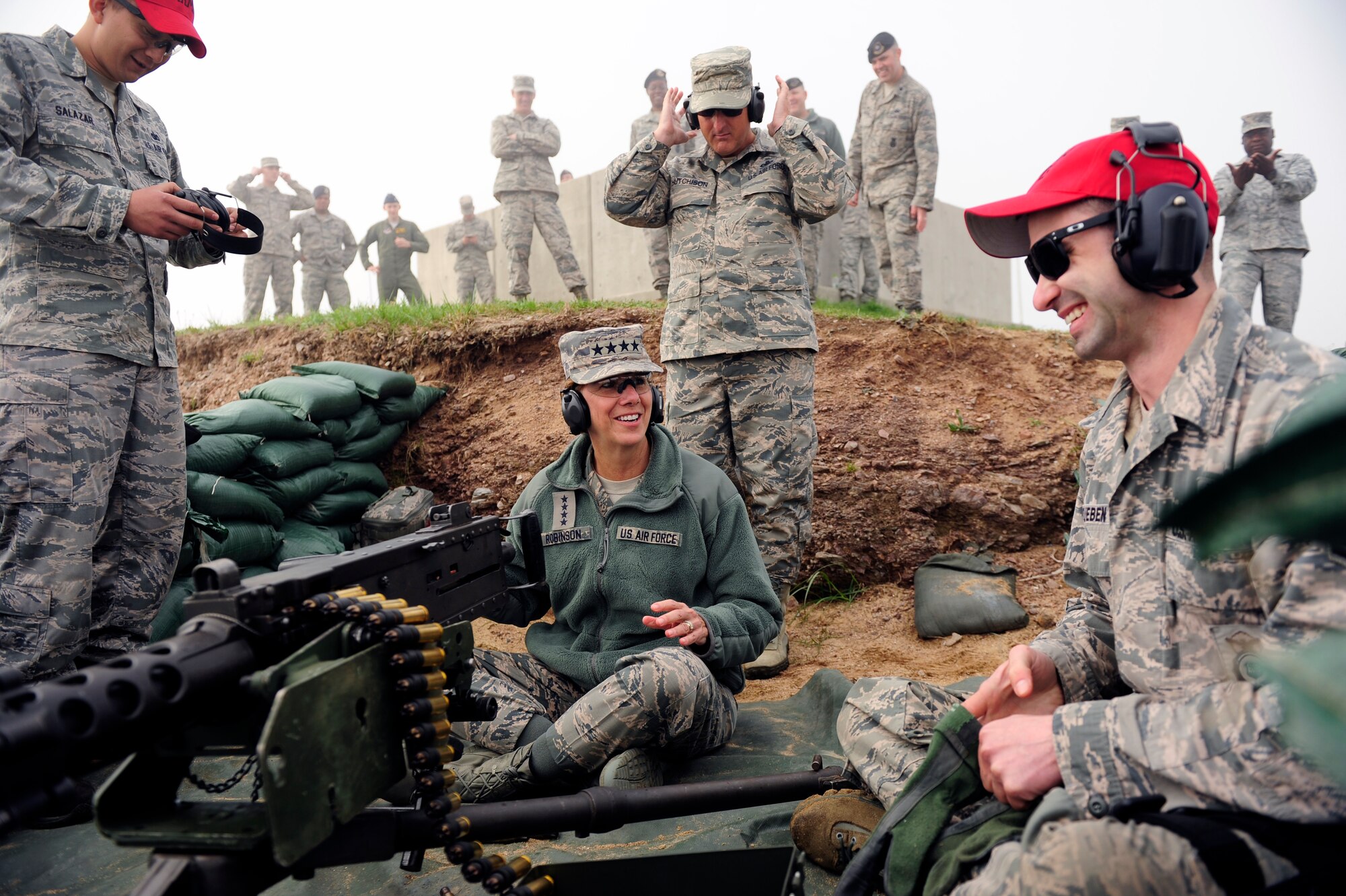 Gen. Lori J. Robinson, Pacific Air Forces commander, prepares to shoot an M-4 caliber machine gun following instruction from an 8th Security Forces Squadron combat arms instructor, during her visit to Kunsan Air Base, Republic of Korea, April 23, 2015. During Robinson’s visit, she had the opportunity to experience hands-on demonstrations as she interacted with the Wolf Pack’s combat-ready Airmen. (U.S. Air Force photo by Senior Airman Taylor Curry/Released)