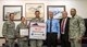 Members of the National Weather Service and 366th Fighter Wing pose for a photo April 23, 2015, at Mountain Home Air Force Base, Idaho. The National Weather Service formally certified Mountain Home Air Force Base under the StormReady program. The program helps arm America's communities with the communication and safety skills needed to save lives and property during severe weather. (U.S. Air Force photo by Airman 1st Class Jeremy L. Mosier/Released)