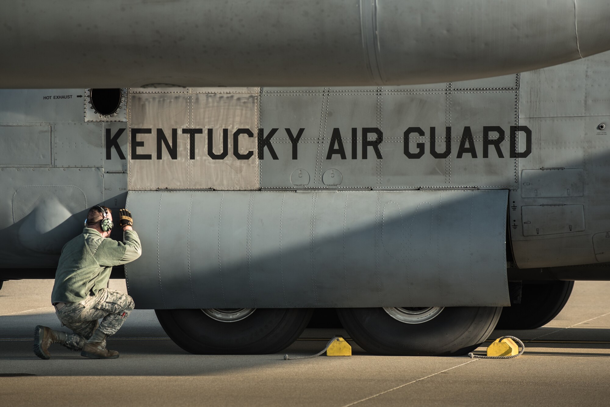 Airman 1st Class Jacob Reynolds, a crew chief in the 123rd Aircraft Maintenance Squadron, inspects a C-130 Hercules aircraft at the Kentucky Air National Guard Base in Louisville, Ky., April 24, 2015. The aircraft and more than 40 members of the 123rd Airlift Wing are deploying to an undisclosed air base in the Persian Gulf region, where they will fly airlift missions in support of Operation Freedom's Sentinel. (U.S. Air National Guard photo by Maj. Dale Greer)