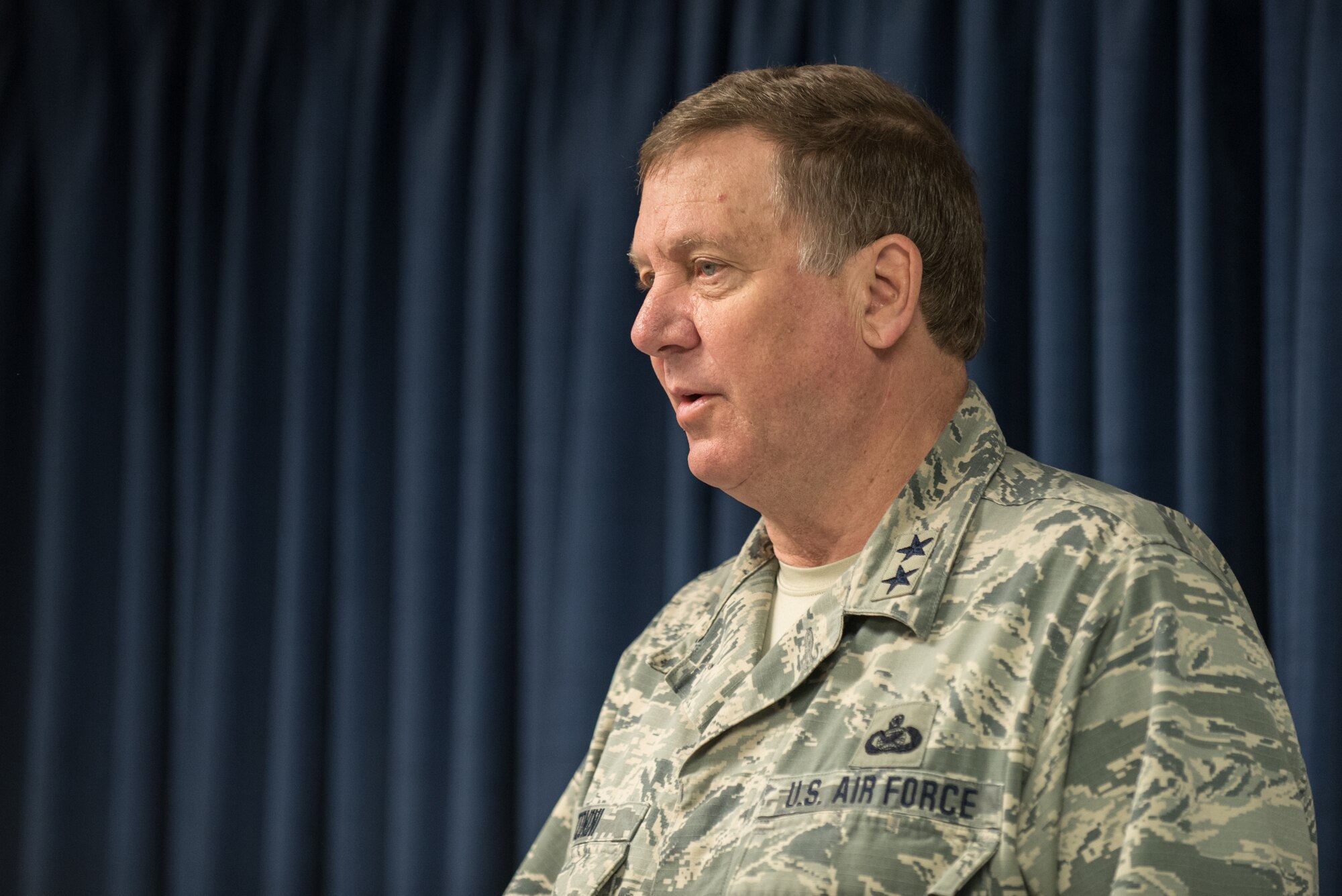 Kentucky's adjutant general, Maj. Gen. Edward W. Tonini, speaks to more than 40 members of the 123rd Airlift Wing at the Kentucky Air National Guard Base in Louisville, Ky., April 24, 2015, prior to the Airmen's deployment to an undisclosed air base in the Persian Gulf region. The troops, who left aboard a Kentucky Air Guard C-130 Hercules aircraft, comprise the third rotation of 123rd Airmen to deploy to the base since February. The Air Guardsmen will be flying airlift missions throughout the U.S. Central Command Area of Responsibility in support of Operation Freedom's Sentinel, which provides military training and counterterrorism capabilities in Afghanistan. (U.S. Air National Guard photo by Maj. Dale Greer)
