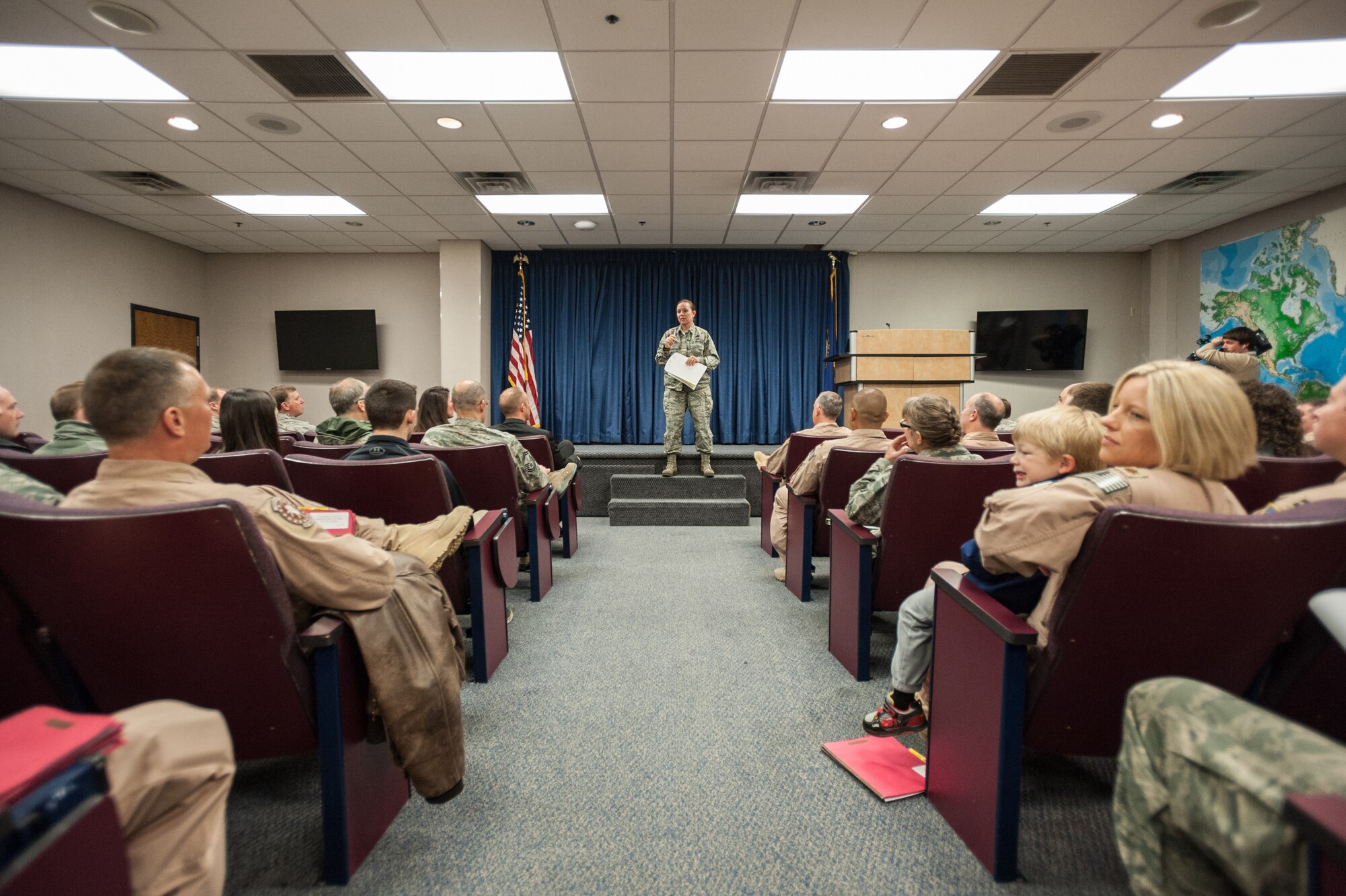 More than 40 members of the 123rd Airlift Wing attend a pre-departure brief at the Kentucky Air National Guard Base in Louisville, Ky., April 24, 2015, prior to deploying to an undisclosed air base in the Persian Gulf region. The Airmen, who left aboard a Kentucky Air Guard C-130 Hercules aircraft, comprise the third rotation of 123rd Airmen to deploy to the base since February. The Air Guardsmen will be flying airlift missions throughout the U.S. Central Command Area of Responsibility in support of Operation Freedom's Sentinel, which provides military training and counterterrorism capabilities in Afghanistan. (U.S. Air National Guard photo by Maj. Dale Greer)
