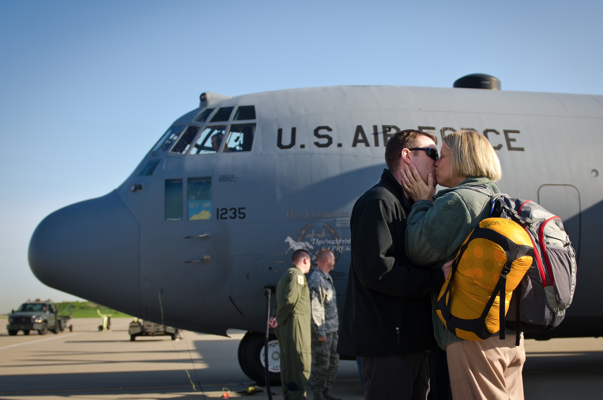 Maj. Jenn Helton, a C-130 navigator in the 123rd Airlift Wing, kisses her husband at the Kentucky Air National Guard Base in Louisville, Ky., April 24, 2015, prior to departing for a deployment to the Persian Gulf. Helton was among more than 40 Kentucky Air National Guardsmen who deployed to an undisclosed air base in support of Operation Freedom’s Sentinel. (U.S. Air National Guard photo by Master Sgt. Phil Speck)