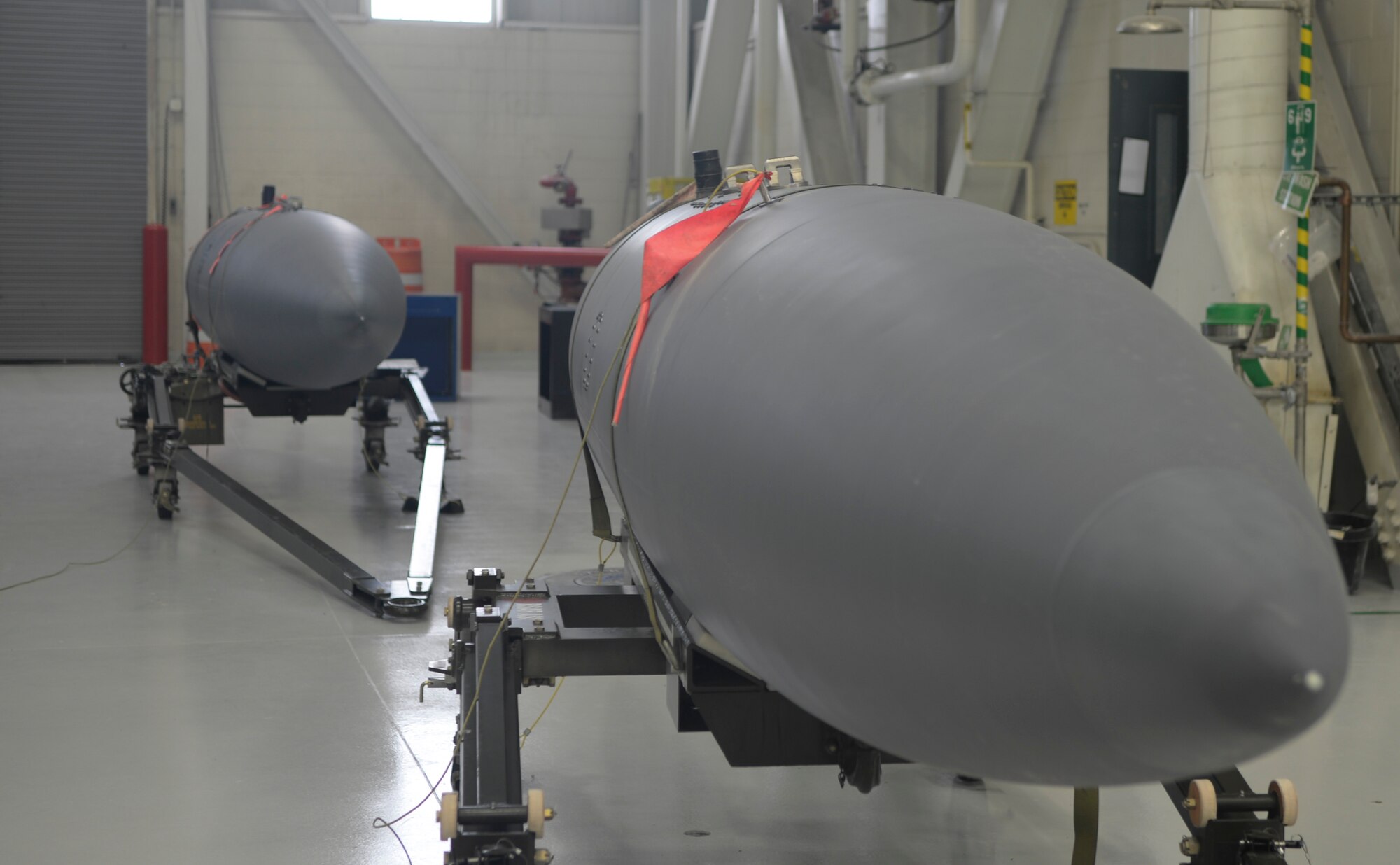 Two completed 600-gallon fuel tanks sit in a hanger at Mountain Home Air Force Base, Idaho, April 20, 2015. Nine augmentees representing different career fields were trained and challenged to build the tanks within 12 hours during the joint exercise Gunfighter Flag 15-2. The team was successful, building the tanks without mistakes in only eight hours. (U.S. Air Force photo by Senior Airman Lauren-Taylor Levin/Released)