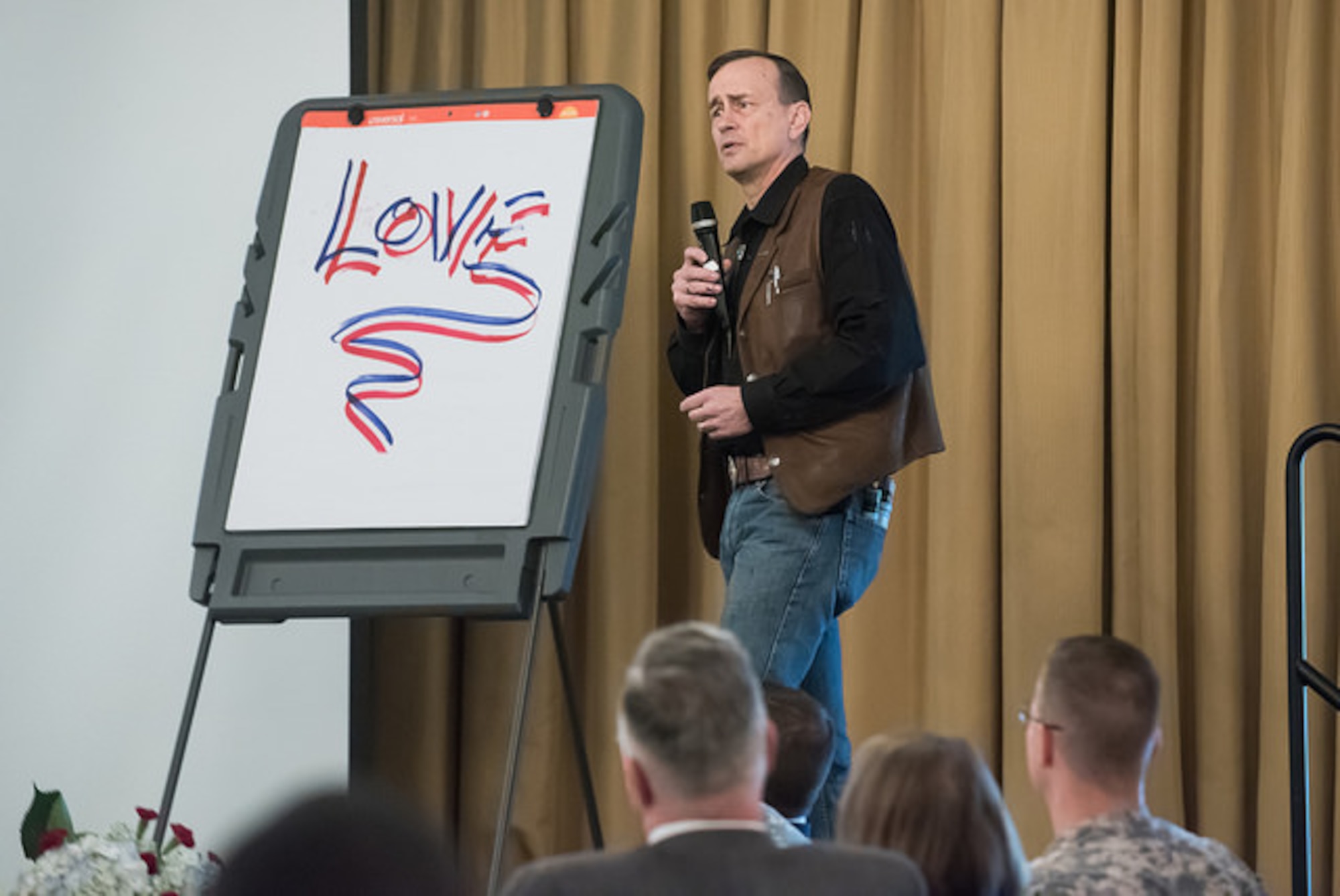 U.S. Army Lt. Col. (retired) David Grossman, speaks at the National Prayer Breakfast April 21, 2015, on Joint Base McGuire-Dix-Lakehurst, N.J. Grossman spoke of the 9/11 terrorist attacks, Sandy Hook massacres, post traumatic stress, and the sacrifices individuals make. Grossman, a former Army Ranger, travels almost 300 days a year, teaching elite military and law enforcement organizations worldwide about the reality of combat and is the author of "On Combat," "Stop Teaching Our Kids to Kill," and "On Killing." (U.S. Air Force photo by Russ Meseroll/Released)
