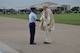 Col. Edwards presents King Rey Feo LXVII with the 2015 Fiesta Medallion during the Fiesta Military Parade at JBSA Lackland, 17 April 2015. 