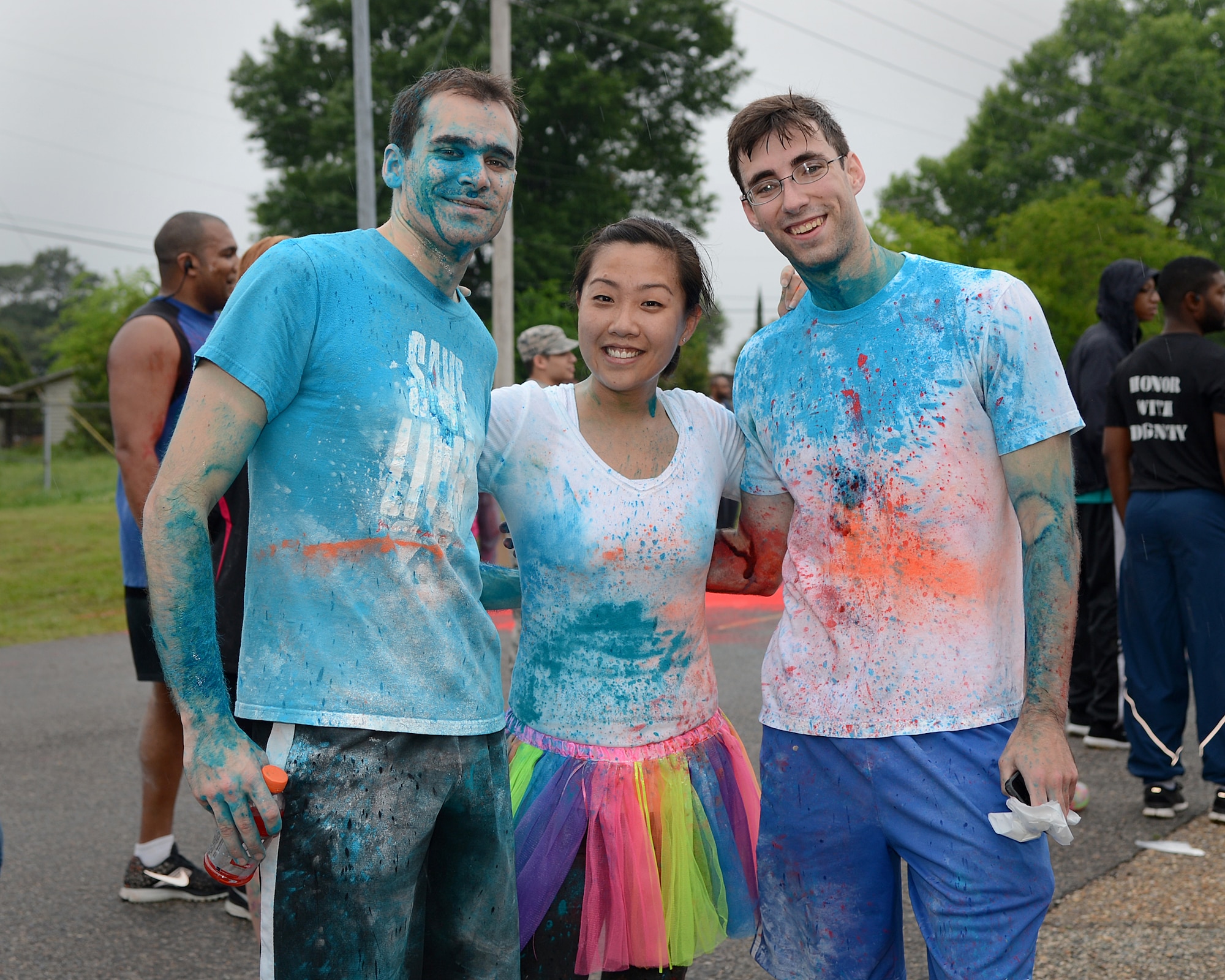 Color Me Run participants pose for a photo on Barksdale Air Force Base, La., April 24, 2015. The 5k was held to promote awareness for Air Force?s helping agencies. (U.S. Air Force photo/Senior Airman Joseph A. Pagán Jr.)