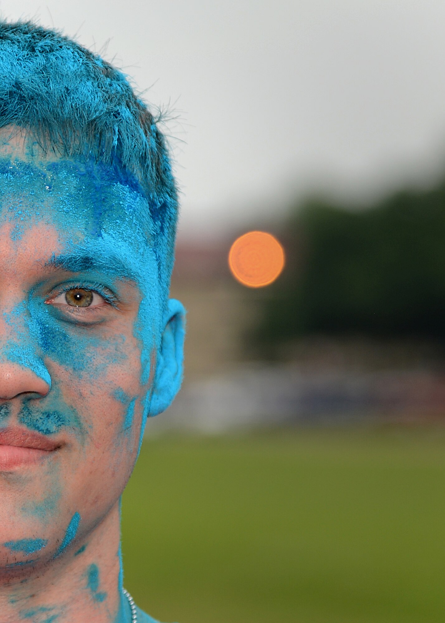 Airman 1st Class Anthony Bahr, 26th Operational Weather Squadron journeyman, poses for a photo after the Color Me Run on Barksdale Air Force Base, La., April 24, 2015. Participants had colored chalk thrown on them during the 5k. (U.S. Air Force photo/Senior Airman Joseph A. Pagán Jr.)