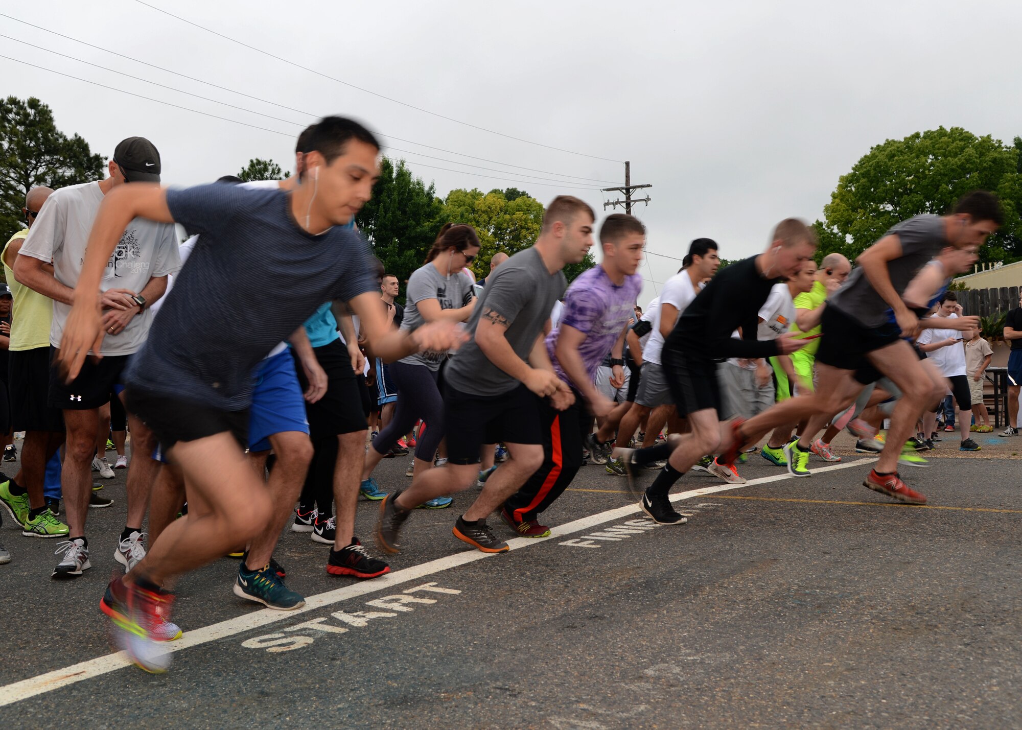 Color Me Run participants begin the 5k on Barksdale Air Force Base, La., April 24, 2015. Airmen from base helping agencies were spread across the route and threw colored chalk on the runners. (U.S. Air Force photo/Senior Airman Joseph A. Pagán Jr.)