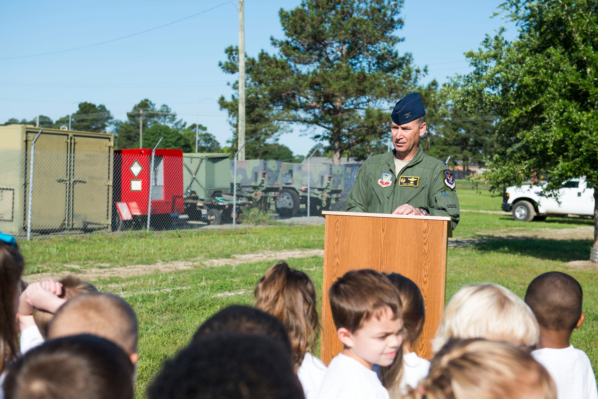 U.S. Air Force Col. Chad Franks, 23d Wing commander, speaks during an Arbor Day tree planting ceremony April 24, 2015, at Moody Air Force Base, Ga. Franks cheered children on as they planted a nuttall oak tree for Moody’s Tree City USA park. (U.S. Air Force photo by Airman 1st Class Dillian Bamman/Released)