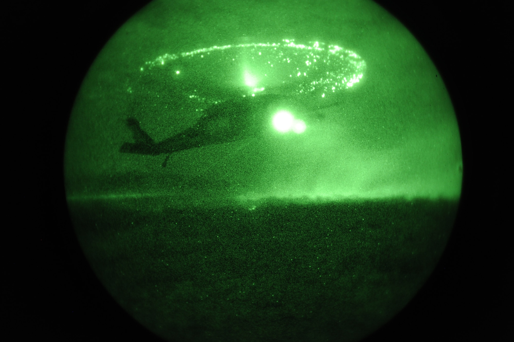 An HH-60 Pavehawk assigned to the 55th Rescue Squadron prepares to land in an open field to assist a 48th Rescue Squadron team exfiltrate patients during a pre-deployment training exercise at Davis-Monthan Air Force Base, Ariz., April 14, 2015. The 55th RQS transported the simulated patients out of the objective area while communicating with the Rescue Team.  (U.S. Air Force photo by Senior Airman Betty R. Chevalier)