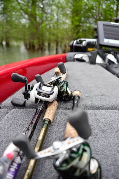 ALEXANDER CITY, Ala. - Multiple fishing rods and reels sit on the deck ready for use. Per the tournamet rules,fisherman may only use one rod at a time but can have unlimited rods set up with different tackle and baits. Having the rods already set up saves time and effort during the day's events. (U.S. Air National Guard photo by Master Sgt. Jerry Harlan/Released)