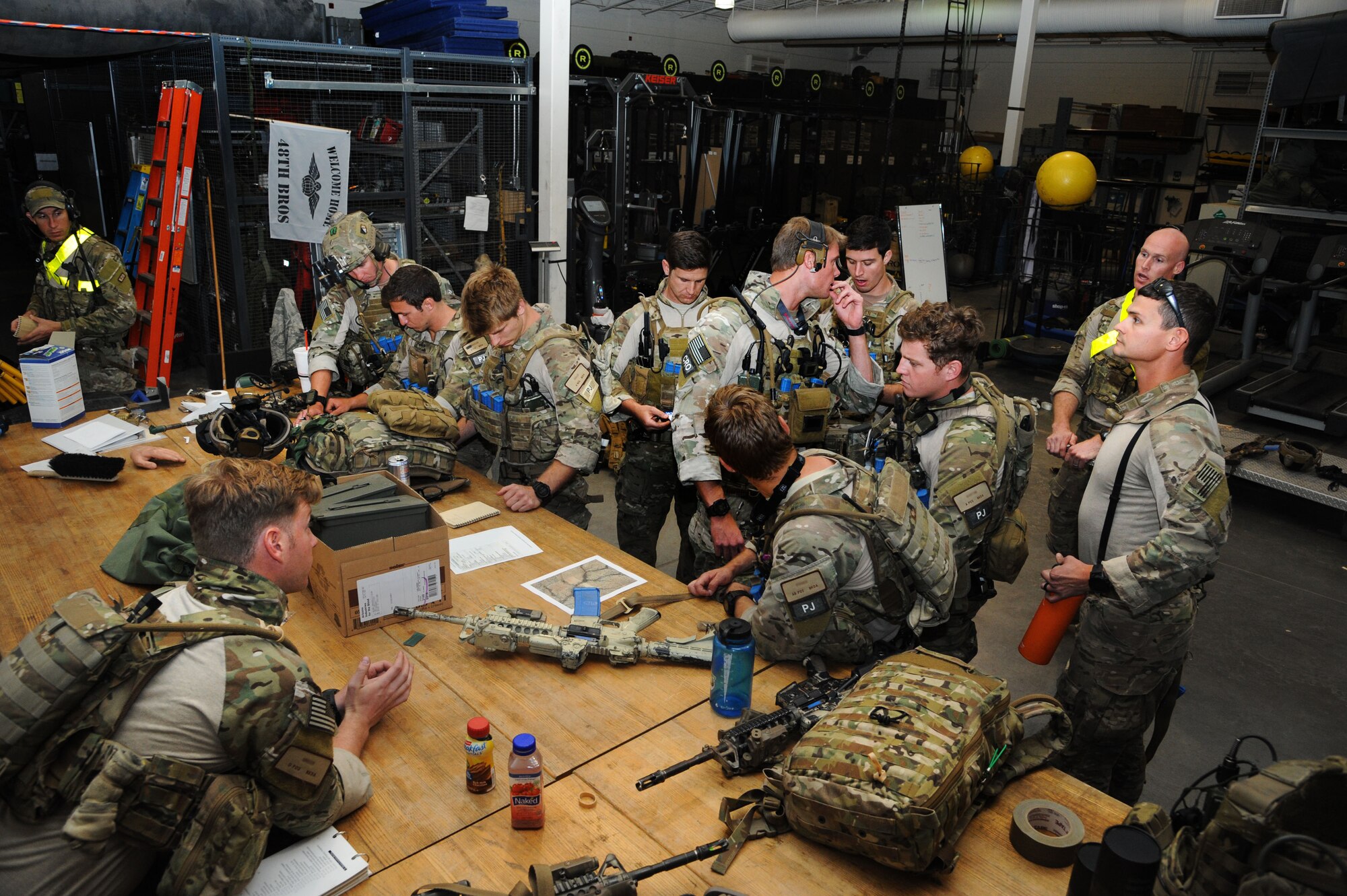 A 48th Rescue Squadron team gears up for a pre-deployment training exercise mission at Davis-Monthan Air Force Base, Ariz., April 14, 2015.  The 48th RQS is a Guardian Angel squadron consisting of Pararescuemen, Combat Rescue Officers, survival specialists and combat support personnel. (U.S. Air Force photo by Senior Airman Betty R. Chevalier) 