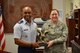 Col. Edwards celebrates with Col. Elizabeth Schuchs-Gopaul, Staff Judge Advocate for the 502nd Installation Support Group and 37th Training Wing, for winning the AETC Large Legal Office of the Year 2014. 