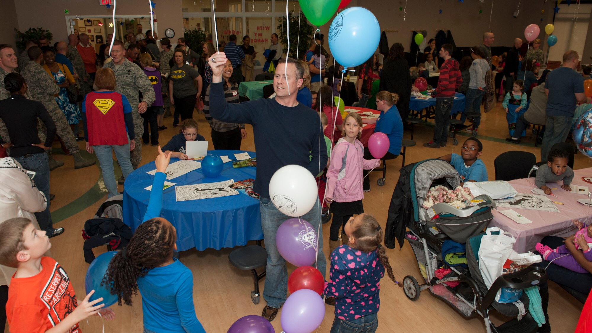 Team Dover Airmen and their families take part in the Deployed Families Dinner April 23, 2015, at the Youth Center on Dover Air Force Base, Del. A Deployed Families Dinner is held quarterly for the families of Deployed Team Dover Airmen. (U.S. Air Force photo/Airman 1st Class Zachary Cacicia)