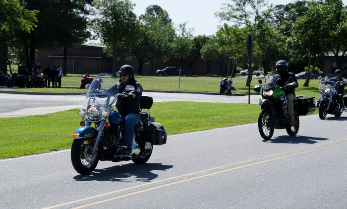 Motorcycle riders take off after the briefing portion of the Annual Motorcycle Safety Day, April 24, 2015 at Joint Base Charleston – Air Base, S.C. More than 100 riders attended the event, which included a Bike Judging Competition, a group ride to Short Stay in Moncks Corner, S.C. and a Street Riding Skills Mentorship Program orientation at JB Charleston – Weapons Station. (U.S. Air Force photo/Staff Sgt. AJ Hyatt)