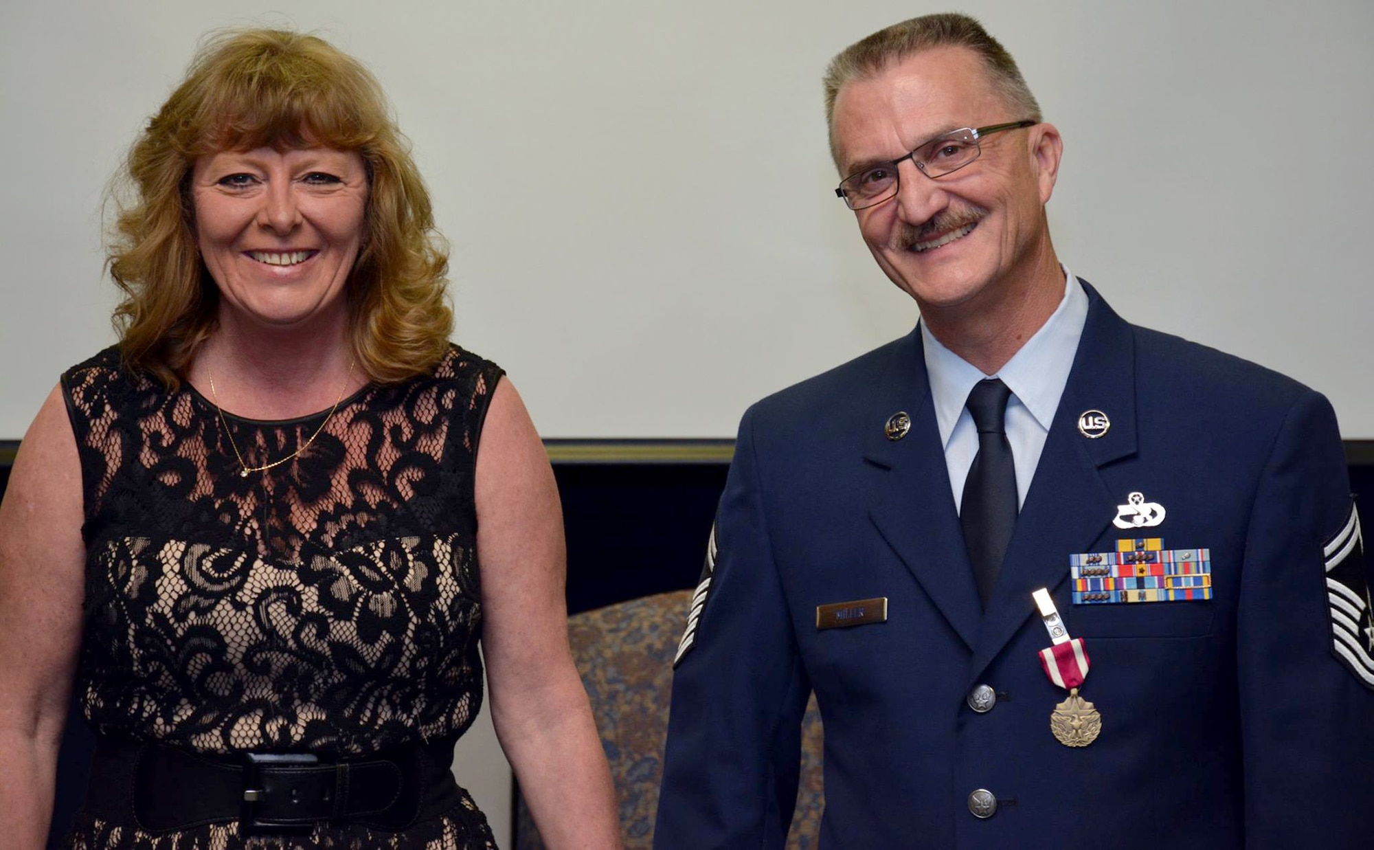 TRAVIS AIR FORCE BASE, Calif. --Senior Master Sgt. Howard C. Miller III and family  celebrate his career during his retirement ceremony April 18, 2015 here at Travis Air Force Base, Calif. (U.S. Air Force photo/Staff Sgt. Christopher Carranza)