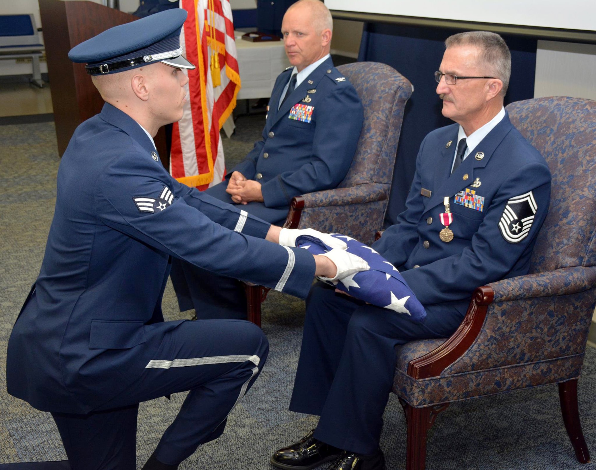 TRAVIS AIR FORCE BASE, Calif. --Senior Master Sgt. Howard C. Miller III and family  celebrate his career during his retirement ceremony April 18, 2015 here at Travis Air Force Base, Calif. (U.S. Air Force photo/Staff Sgt. Christopher Carranza)