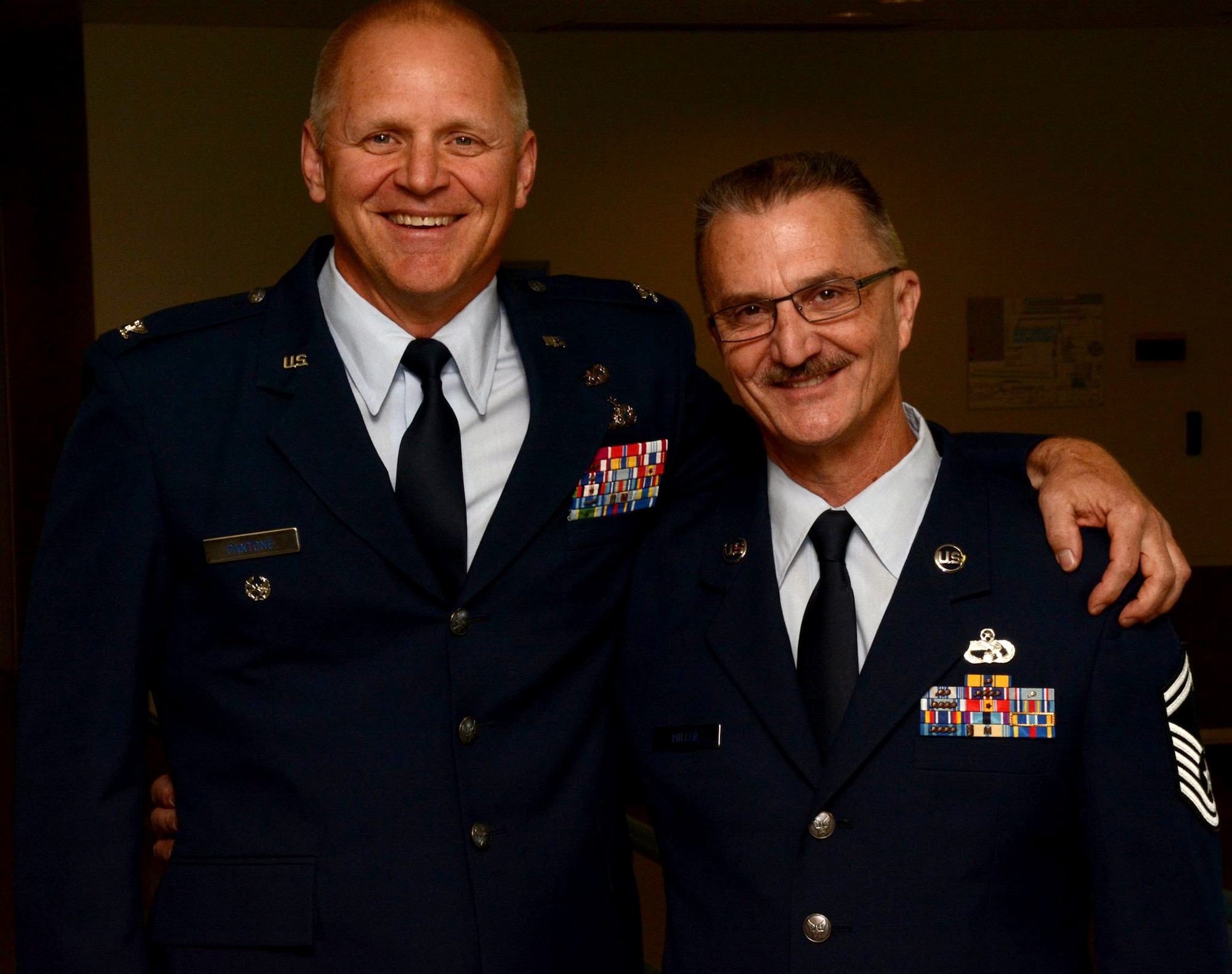 TRAVIS AIR FORCE BASE, Calif. --Senior Master Sgt. Howard C. Miller III and family  celebrate his career during his retirement ceremony April 18, 2015 here at Travis Air Force Base, Calif. (U.S. Air Force photo/Staff Sgt. Christopher Carranza)