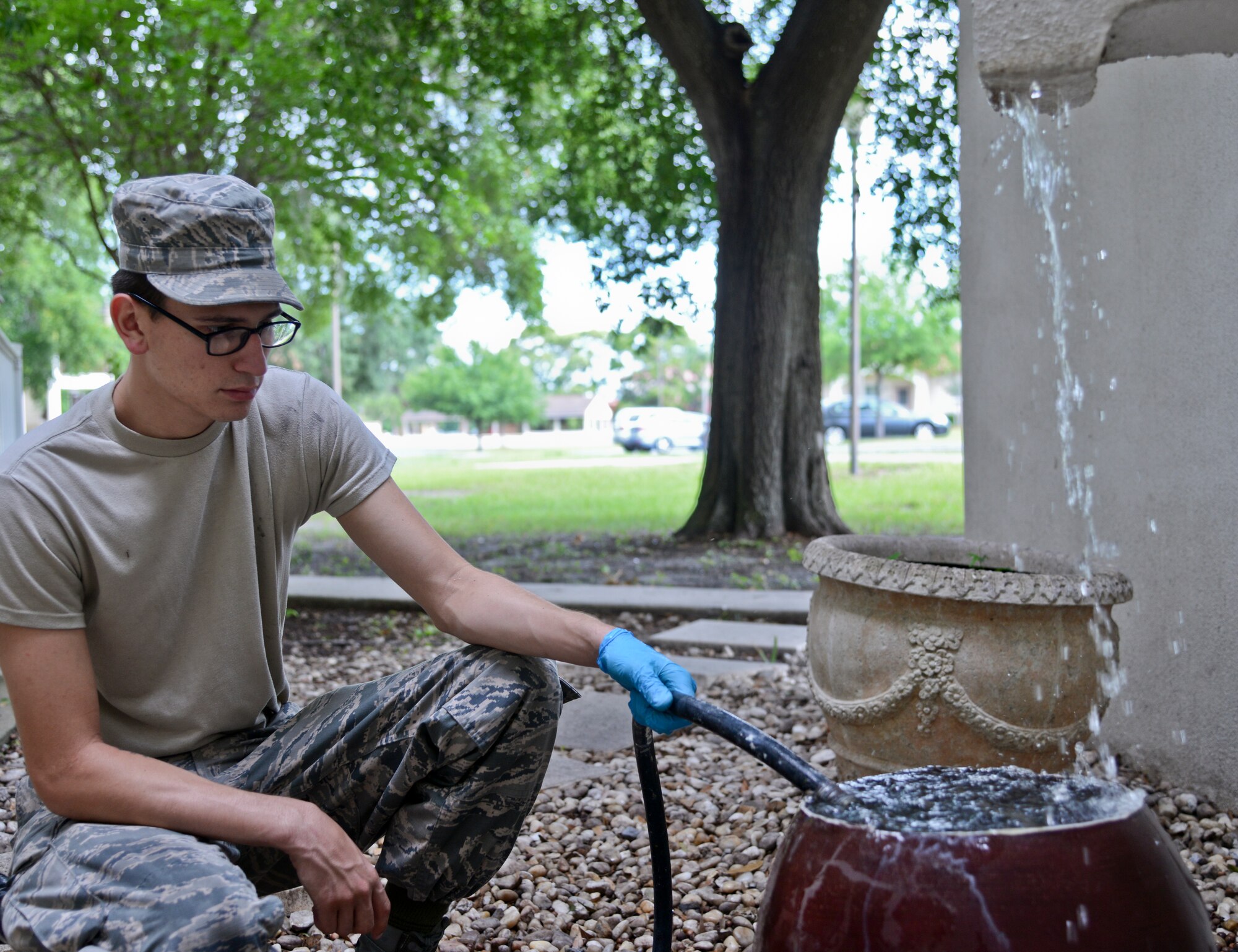 Airman 1st Class Alexander Lopez, 6th Operations Support Squadron, empties a lint trap at MacDill Air Force Base, Fla., April 23, 2015. Despite being behind the scenes, the bay orderlies play a very important role in ensuring the dormitories are maintained. (U.S. Air Force photo by Senior Airman Vernon L. Fowler Jr./Released)