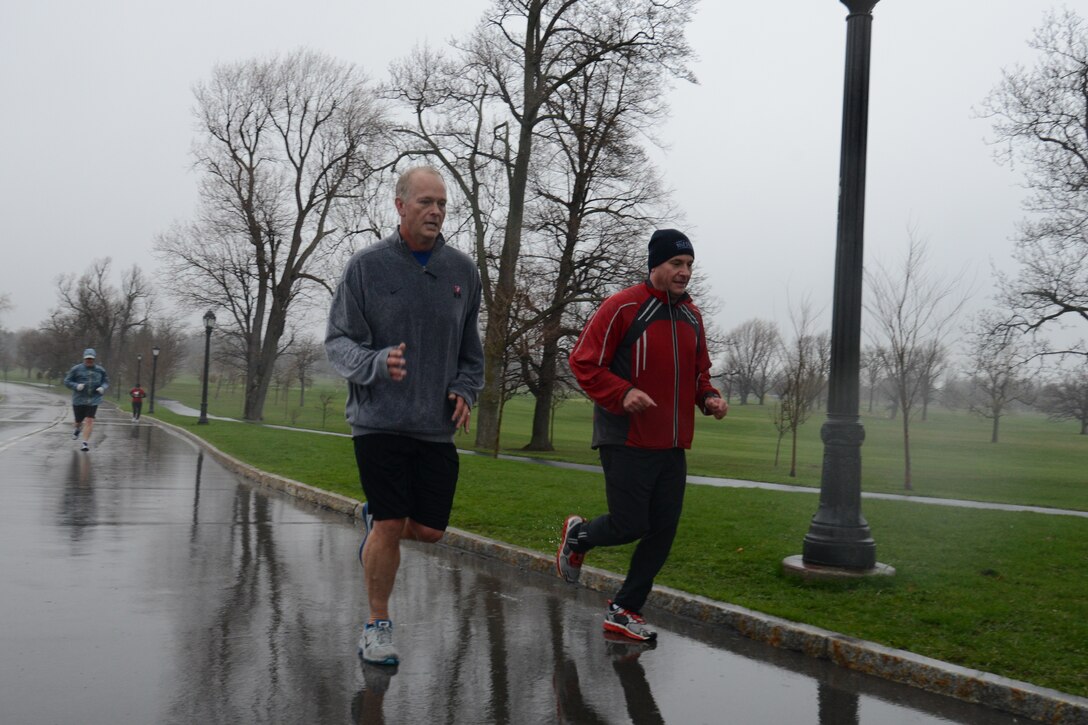 914th Airlift Wing Commander Col. Steven Parker (left) and Command Chief Master Sgt. Clint Ronan, near the finish line during a run celebrating the U.S. Air Force Reserve Birthday Delaware Park in Buffalo, NY April 22, 2015. Airmen of the 914th Airlift Wing and the local chapter of Team Red White and Blue, a Veteran Outreach organization, ran a cumulative 67 laps at Delaware Park in Buffalo, NY in honor of the 67th birthday of the U.S. Air Force Reserve. (U.S. Air Force photo by Tech. Sgt. Andrew Caya)