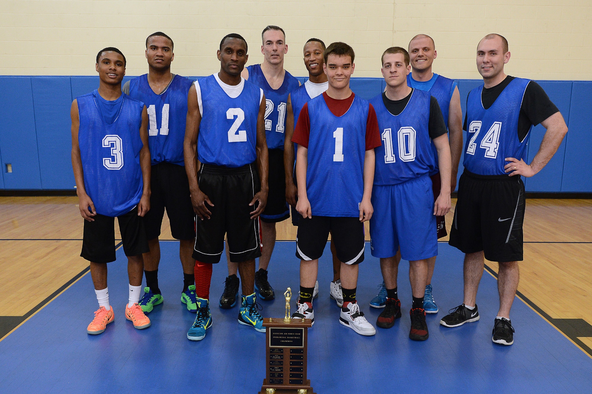 Members of the C3I, Infrastructure Division pose for a team photo after winning the 2015 Hanscom Intramural Championship at the Fitness and Sports Center, April 21. The team beat a team from Massachusetts Institute of Technology Lincoln Laboratory, 40 to 25,  (U.S. Air Force photo by Jerry Saslav) 