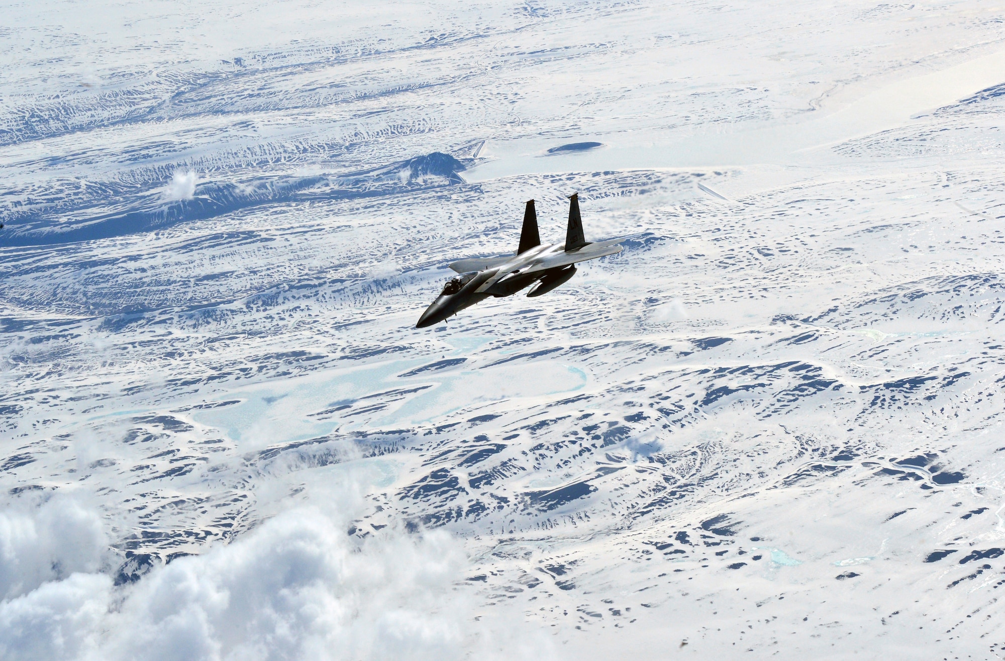 An F-15C Eagle fighter aircraft flies over Iceland during Icelandic Air Surveillance and Policing April 22, 2015. IAS is a recurring NATO mission designed to maintain the security of Icelandic airspace by providing a fighter aircraft presence in the region. (U.S. Air Force photo by 2nd Lt Meredith Mulvihill/Released)