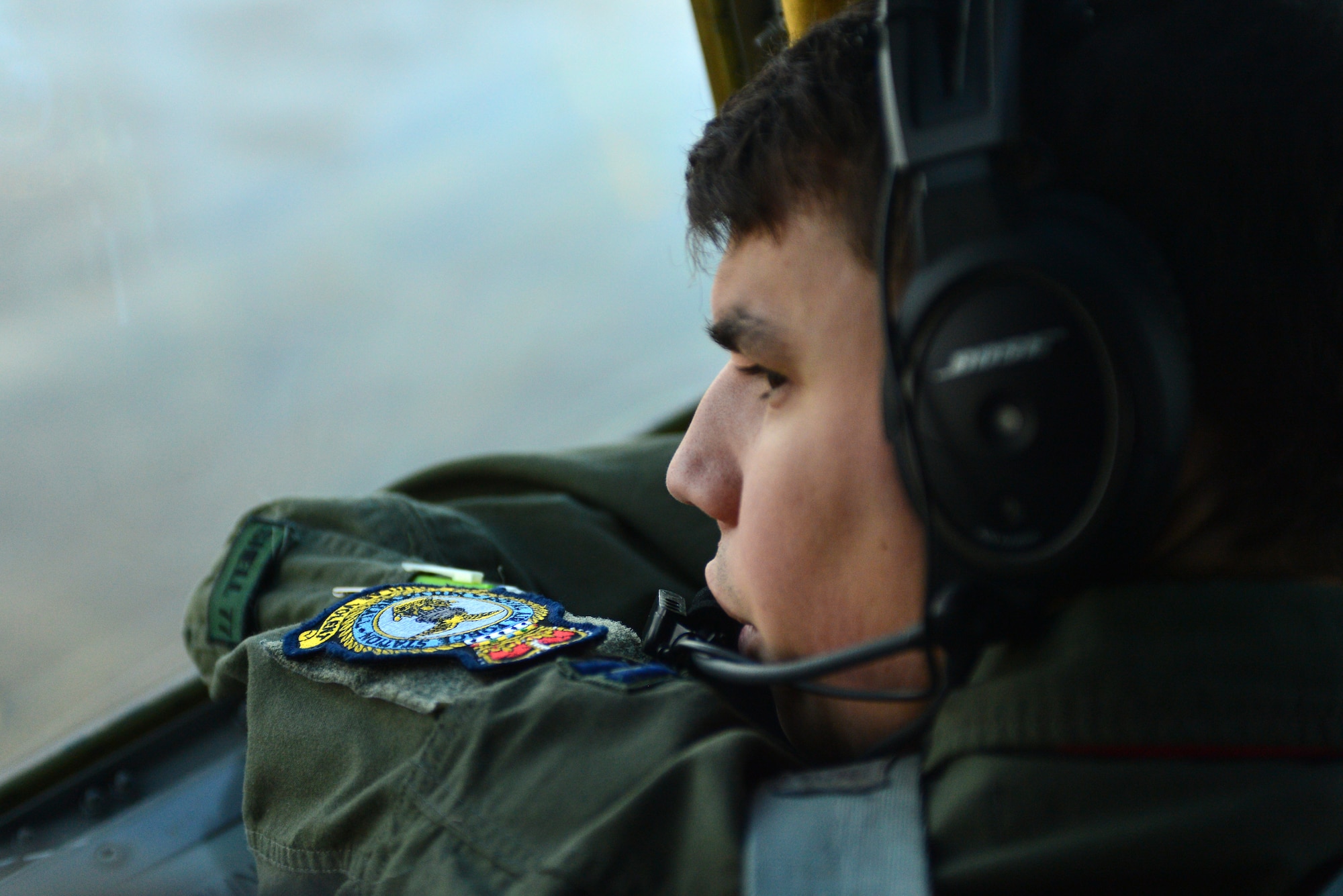 U.S. Air Force Capt. Brian Dunn, an 871st  Air Expeditionary Squadron KC-135 Stratotanker pilot, looks out the window of a KC-135 Stratotanker during pre-flight operations as part of Icelandic Air Surveillance and Policing at Keflavik International Airport, Iceland, April 22, 2015. The KC-135 provides air refueling capability to U.S. Air Force fighter assets, increasing their range and increasing mission capability. IAS is a recurring NATO mission designed to maintain the security of Icelandic airspace by providing a fighter aircraft presence in the region. (U.S. Air Force photo by 2nd Lt Meredith Mulvihill/Released)