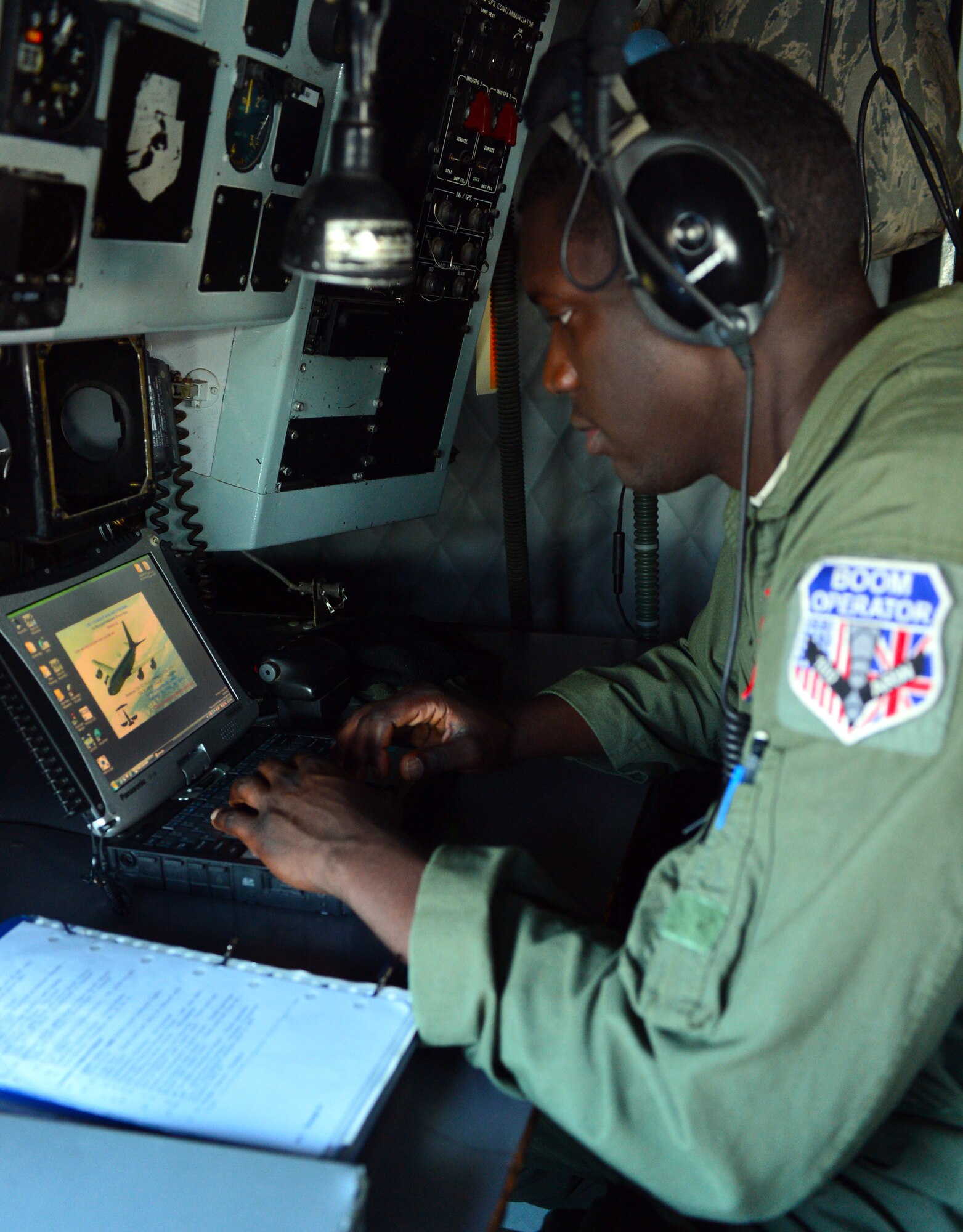 U.S. Air Force Senior Airman Devaughn Granger, an 871st Air Expeditionary Squadron KC-135 boom operator, performs pre-flight operations on a KC-135 Stratotanker during Icelandic Air Surveillance and Policing at Keflavik International Airport, Iceland, April 22, 2015. The boom operator is responsible for establishing and maintaining the link between the KC-135 and the aircraft receiving fuel during in-flight refueling. IAS is a recurring NATO mission designed to maintain the security of Icelandic airspace by providing a fighter aircraft presence in the region. (U.S. Air Force photo by 2nd Lt Meredith Mulvihill/Released)