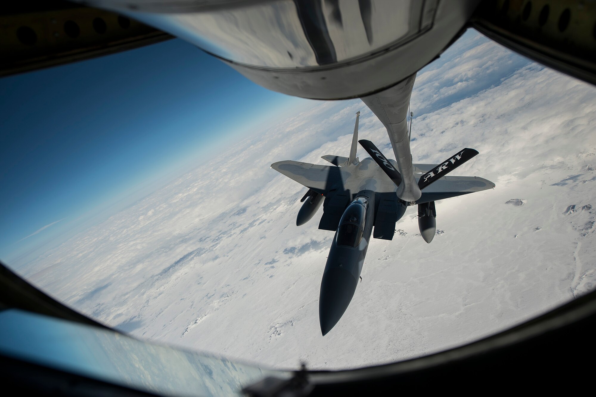 A U.S. Air Force F-15C Eagle fighter aircraft assigned to the 871st Air Expeditionary Squadron approaches the boom of a KC-135 Stratotanker aircraft prior to refueling over Iceland during the Icelandic Air Surveillance and Policing mission April 22, 2015. Working in tandem with the air refueling capability, the F-15s are able to operate with increased range and mission effectiveness. The IAS mission is a recurring NATO commitment designed to maintain the security of Icelandic airspace by providing a fighter aircraft presence in the region. (U.S. Air Force photo by Staff Sgt. Chad Warren/Released)