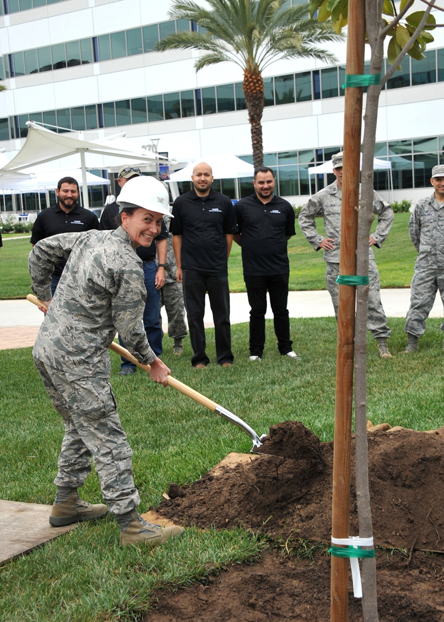 Air Force Colonel Donna Turner, commander of the 61st Air Base Group, at Los Angeles Air Force Base and members of the 61st Civil Engineering and Logistics Squadron participate in a tree-planting ceremony to kick off the Earth Day celebration on April 21, (U.S. Air Force photo by Sarah Corrice)