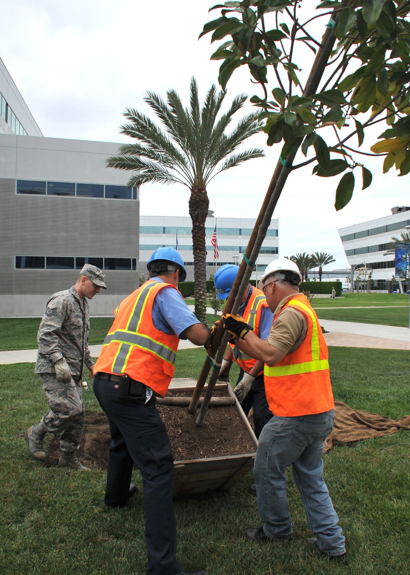 Air Force Colonel Donna Turner, commander of the 61st Air Base Group, at Los Angeles Air Force Base and members of the 61st Civil Engineering and Logistics Squadron participate in a tree-planting ceremony to kick off the Earth Day celebration on April 21, (U.S. Air Force photo by Sarah Corrice)