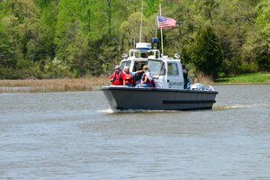 Patrons enjoy a wildlife boat tour as part of Earth Week at Fort Eustis, Va., April 21, 2015. During the tour, observers saw and learned about local wildlife such as eagles, ospreys and belted kingfishers. (U.S. Air Force photo by Senior Airman Kimberly Nagle/Released)