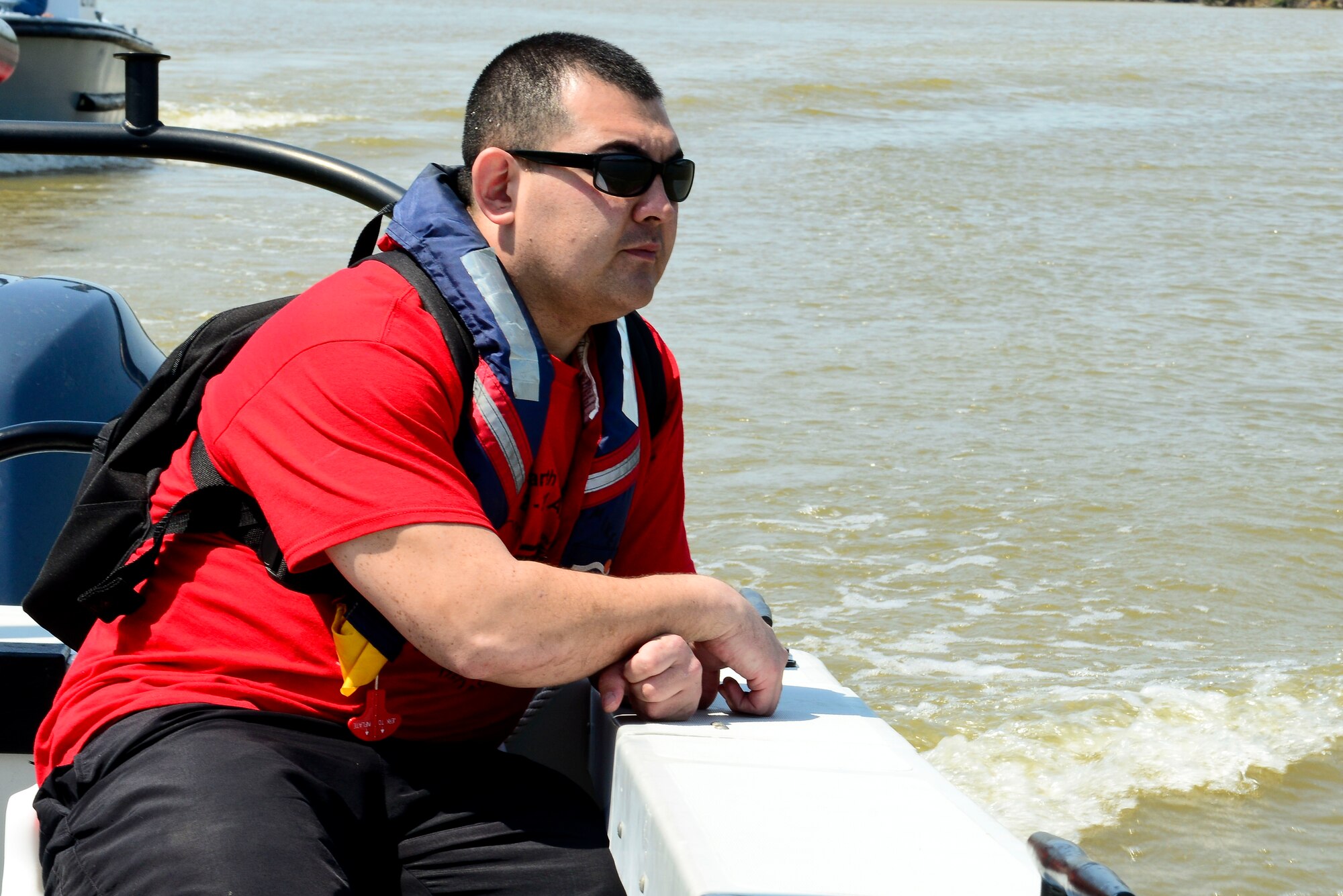 U.S. Army Sgt. 1st Class James Conover, Alpha Company, 1st Battalion, 210th Aviation Regiment, 128th Aviation Brigade S3 schools and operations instructor, participates in a wildlife boat tour as part of Earth Week at Fort Eustis, Va., April 21, 2015. The Joint Base Langley-Eustis Environmental team hosted a number of events throughout the week that teaches the importance of environmental friendliness and improves JBLE and the local community’s ecosystem. (U.S. Air Force photo by Senior Airman Kimberly Nagle/Released)