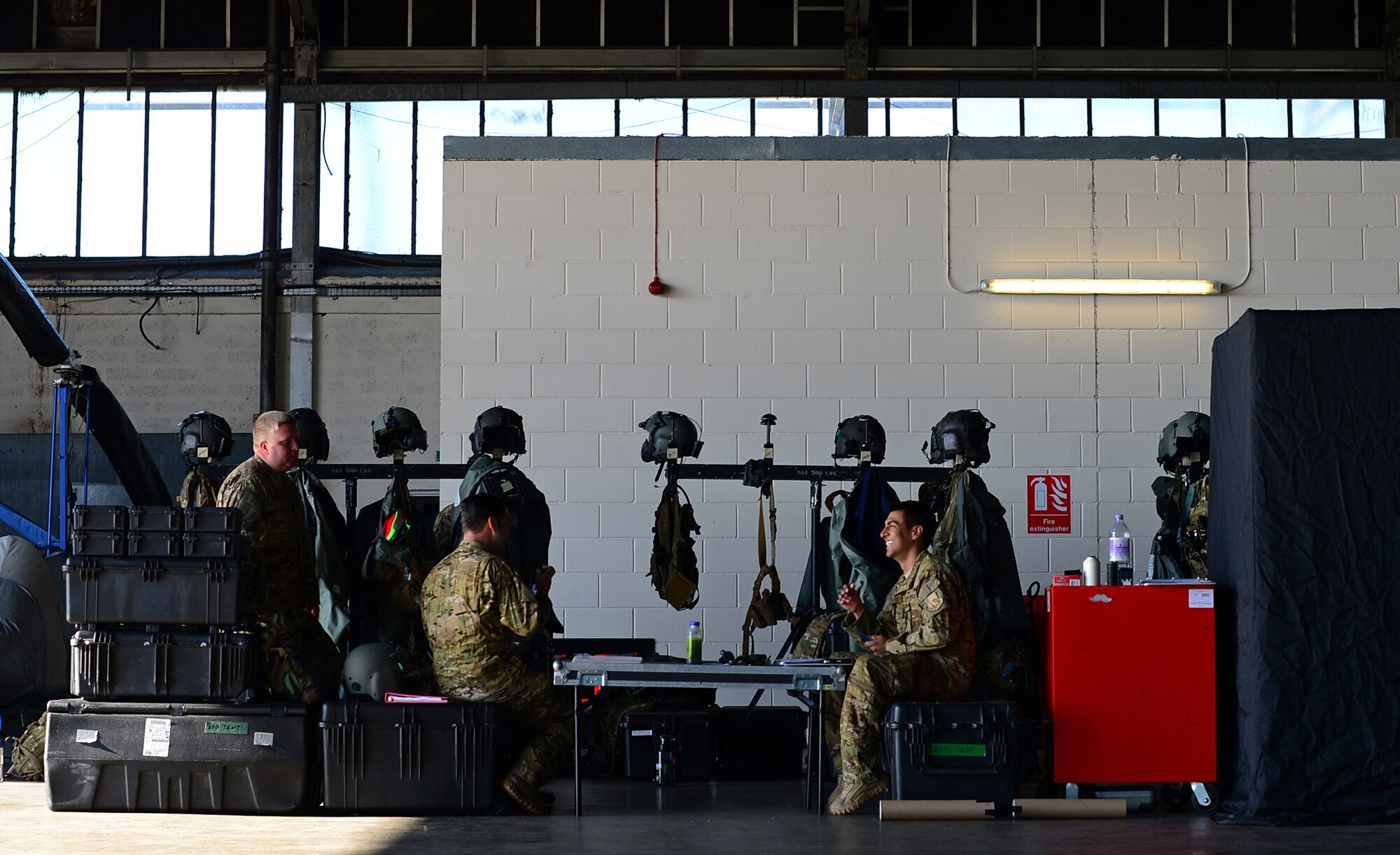 U.S. Air Force Airmen from the 56th Rescue Squadron review information during exercise Joint Warrior 15-1 in Scotland, April 20, 2015. Royal Air Force Lakenheath's 56th and 57th RQSs participated in the exercise to enhance their ability to work with NATO allies. (U.S. Air Force photo by Senior Airman Erin O'Shea/Released)