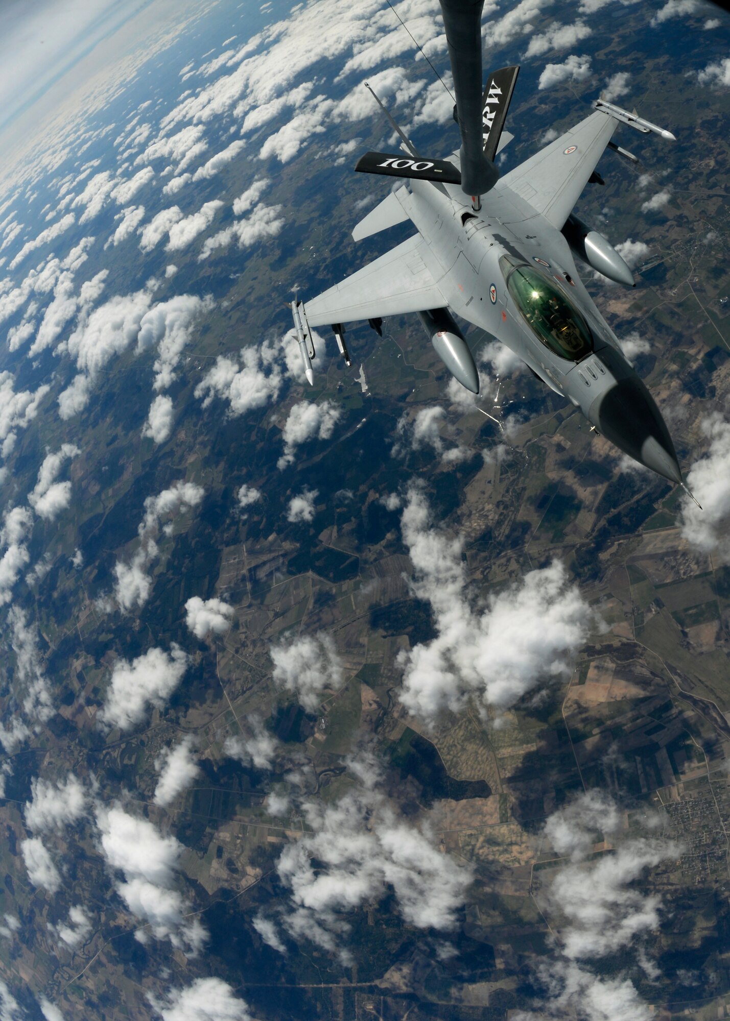 An F-16 Fighting Falcon assigned to the Royal Norwegian Air Force receives fuel from a KC-135 Stratotanker assigned to RAF Mildenhall, England, while participating in in a training event April 22, 2015, over the Baltic region. The Baltic Region Training Event is focused on enhancing air interoperability and cooperation among NATO and regional partner air forces. (U.S. Air Force photo by Senior Airman Victoria H. Taylor/Released)