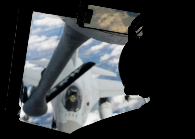 U.S. Air Force Airman Nicholas Sowder, 351st Air Refueling Squadron boom operator from Madrid, Iowa, prepares to refuel an F-16 Fighting Falcon assigned to the Royal Norwegian Air Force while participating in a training event April 22, 2015, over the Baltic region. The Baltic Region Training Event serves as a way to promote interoperability, security and relations with allies and partners in the spirit of partnership for peace. (U.S. Air Force photo by Senior Airman Victoria H. Taylor/Released)