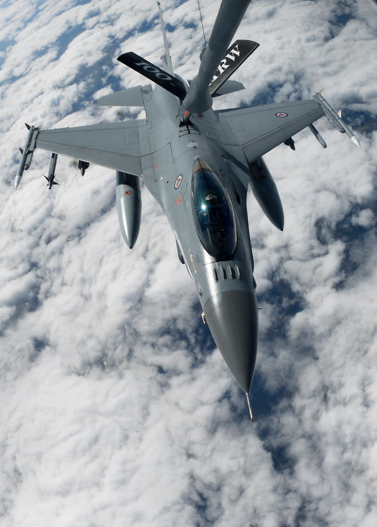 An F-16 Fighting Falcon assigned to the Royal Norwegian Air Force receives fuel from a KC-135 Stratotanker assigned to RAF Mildenhall, England, while participating in the Baltic Region Training Event April 22, 2015, over the Baltic region. The BRTE is focused on enhancing air interoperability and cooperation among NATO and regional partner air forces. (U.S. Air Force photo by Senior Airman Victoria H. Taylor/Released)