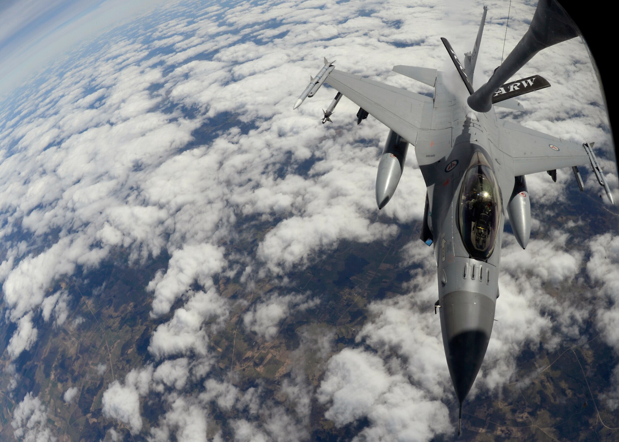 An F-16 Fighting Falcon assigned to the Royal Norwegian Air Force receives fuel from a KC-135 Stratotanker assigned to RAF Mildenhall, England, while participating in the Baltic Region Training Event April 22, 2015, over the Baltic region. The BRTE is focused on enhancing air interoperability and cooperation among NATO and regional partner air forces. (U.S. Air Force photo by Senior Airman Victoria H. Taylor/Released)