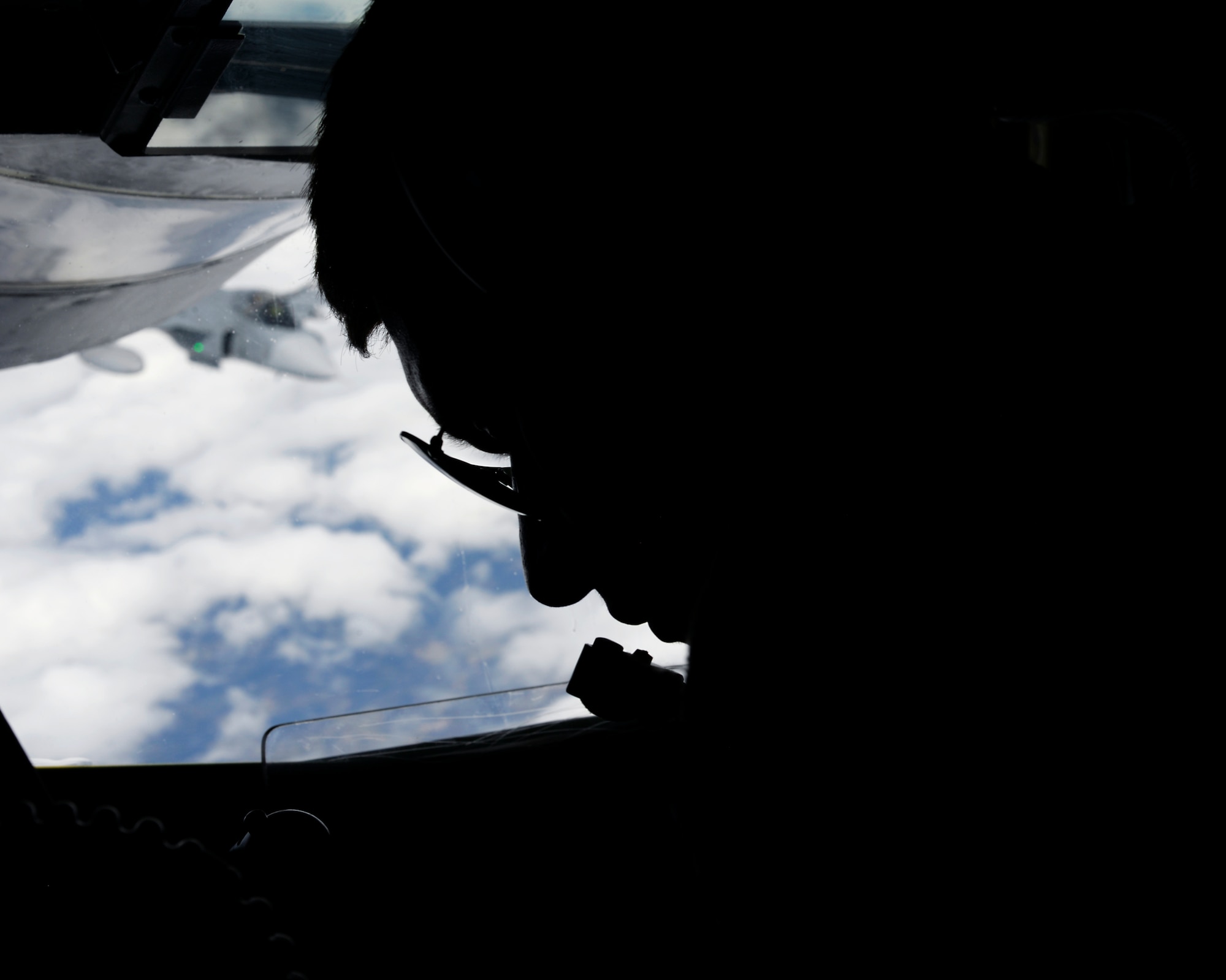 U.S. Air Force Airman Nicholas Sowder, 351st Air Refueling Squadron boom operator from Madrid, Iowa, pauses to look at the operational steps to ensure a successful refueling while participating in the Baltic Region Training Event April 22, 2015, over the Baltic region. The BRTE serves as a way to promote interoperability, security and relations with allies and partners in the spirit of partnership for peace. (U.S. Air Force photo by Senior Airman Victoria H. Taylor/Released)