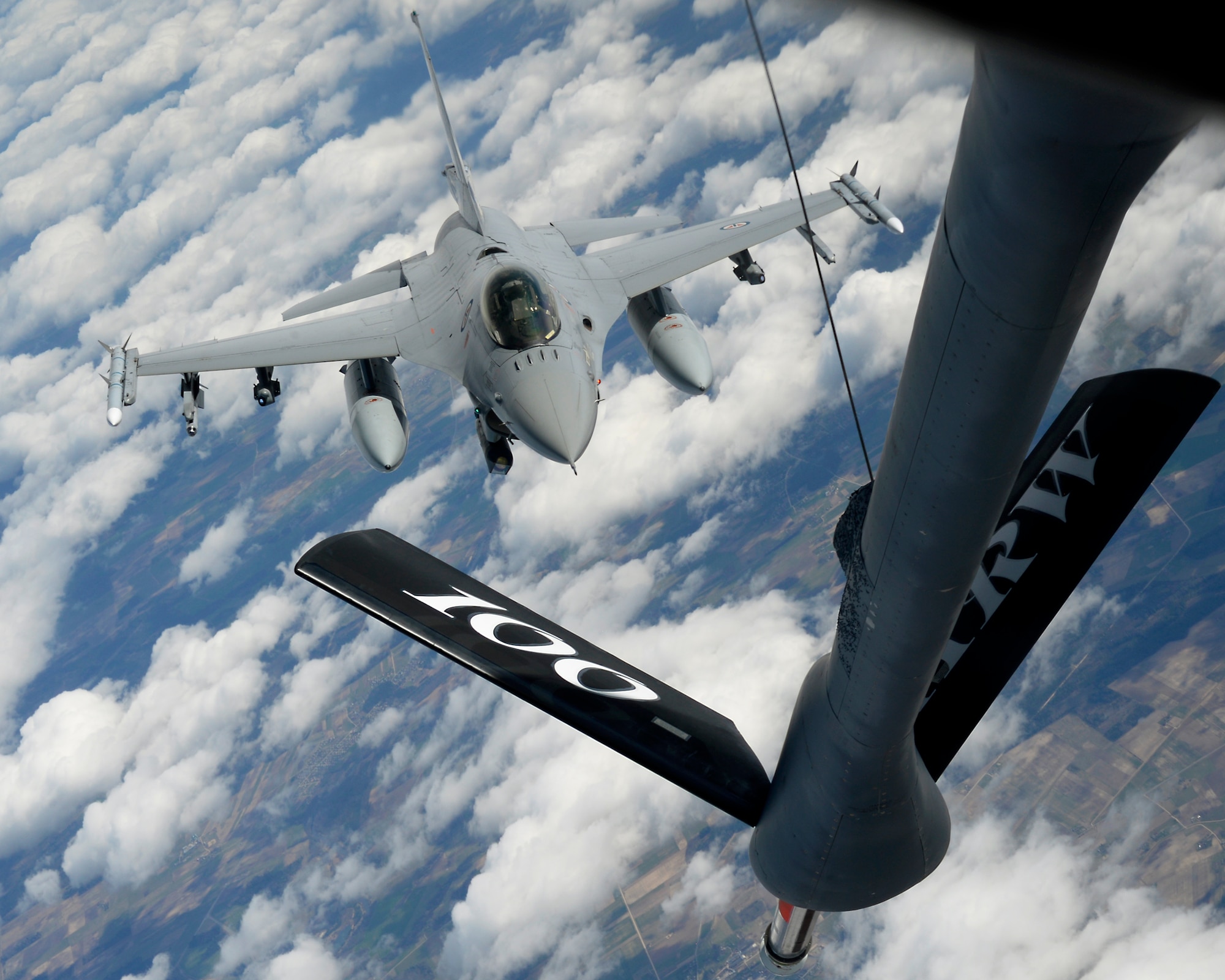 An F-16 Fighting Falcon assigned to the Royal Norwegian Air Force approaches the boom of a KC-135 Stratotanker assigned to RAF Mildenhall, England, while participating in the Baltic Region Training Event April 22, 2015, over the Baltic region. The BRTE is focused on enhancing air interoperability and cooperation among NATO and regional partner air forces. (U.S. Air Force photo by Senior Airman Victoria H. Taylor/Released)